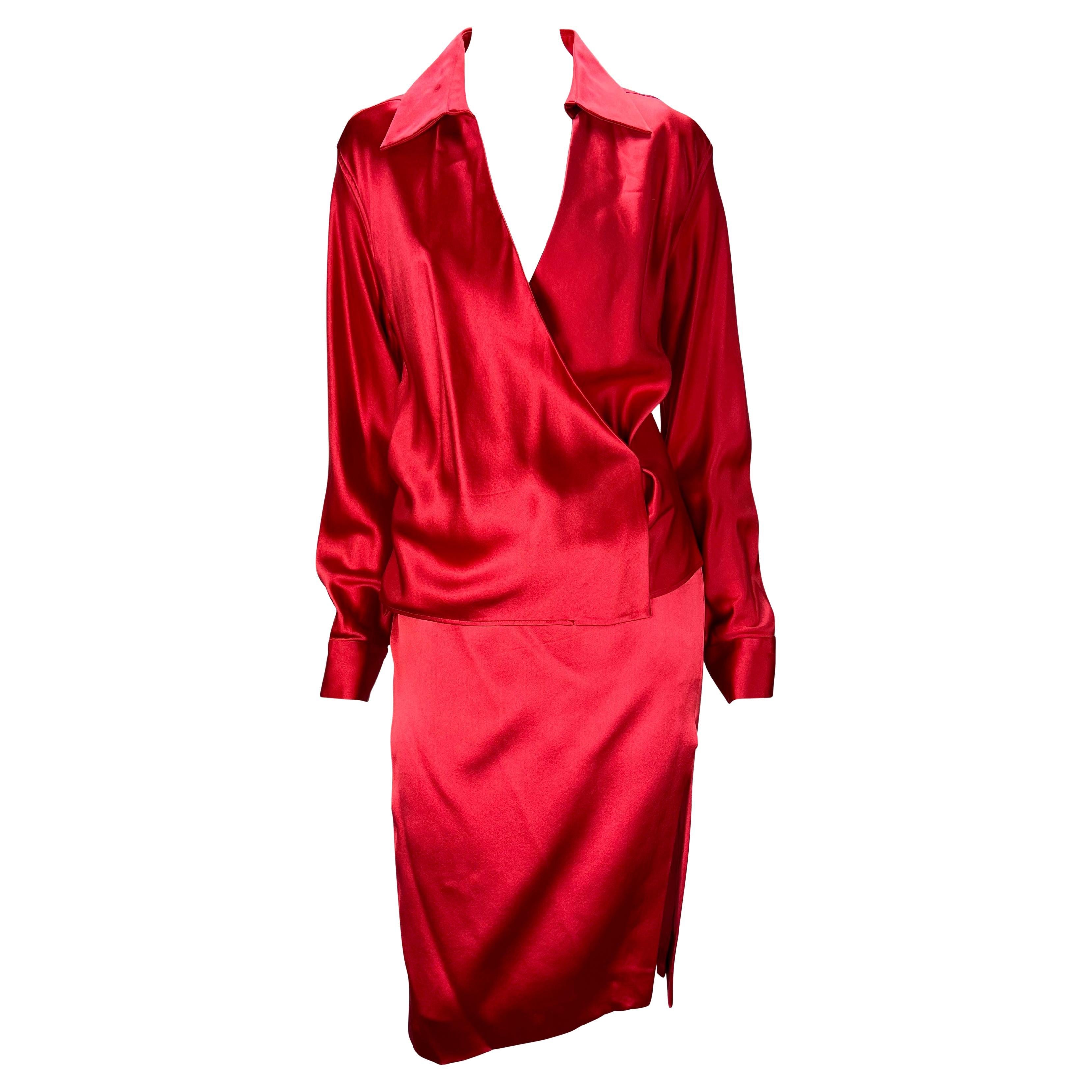 Presenting an absolutely stunning red satin Gucci skirt set, designed by Tom Ford. From the Spring/Summer 2001 collection, this two-piece set is made up of a pencil skirt and matching wrap blouse. Both pieces are constructed of a luxurious satin