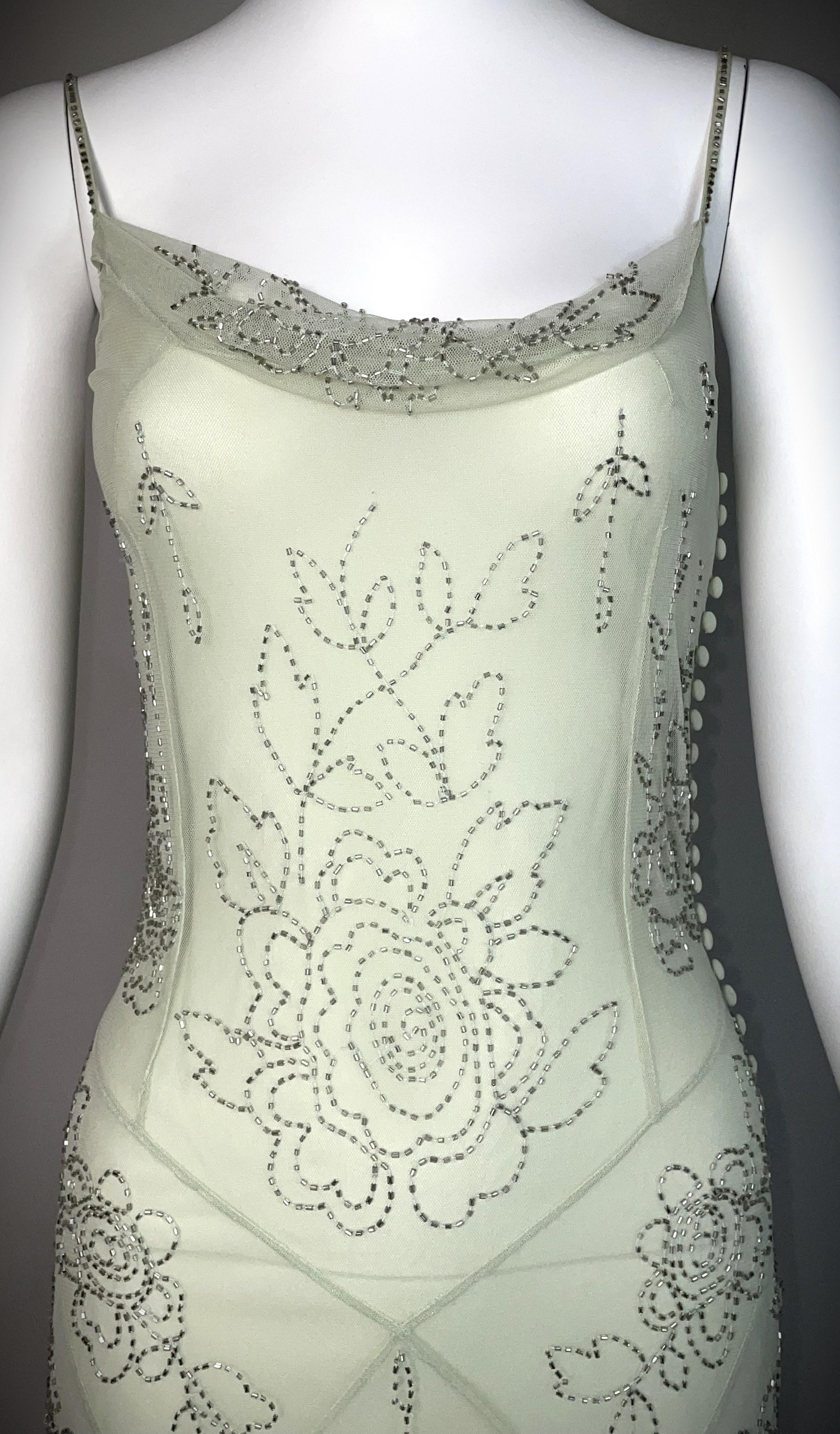 DESIGNER: S/S 2001 John Galliano
CONDITION: Good- Incredibly faint mark inside on lining- nothing seen (last photo)- didn't see anything missing but have have minor bead loss
COUNTRY MADE: France
SIZE: 38
FABRIC: silk
MEASUREMENTS; provided as a