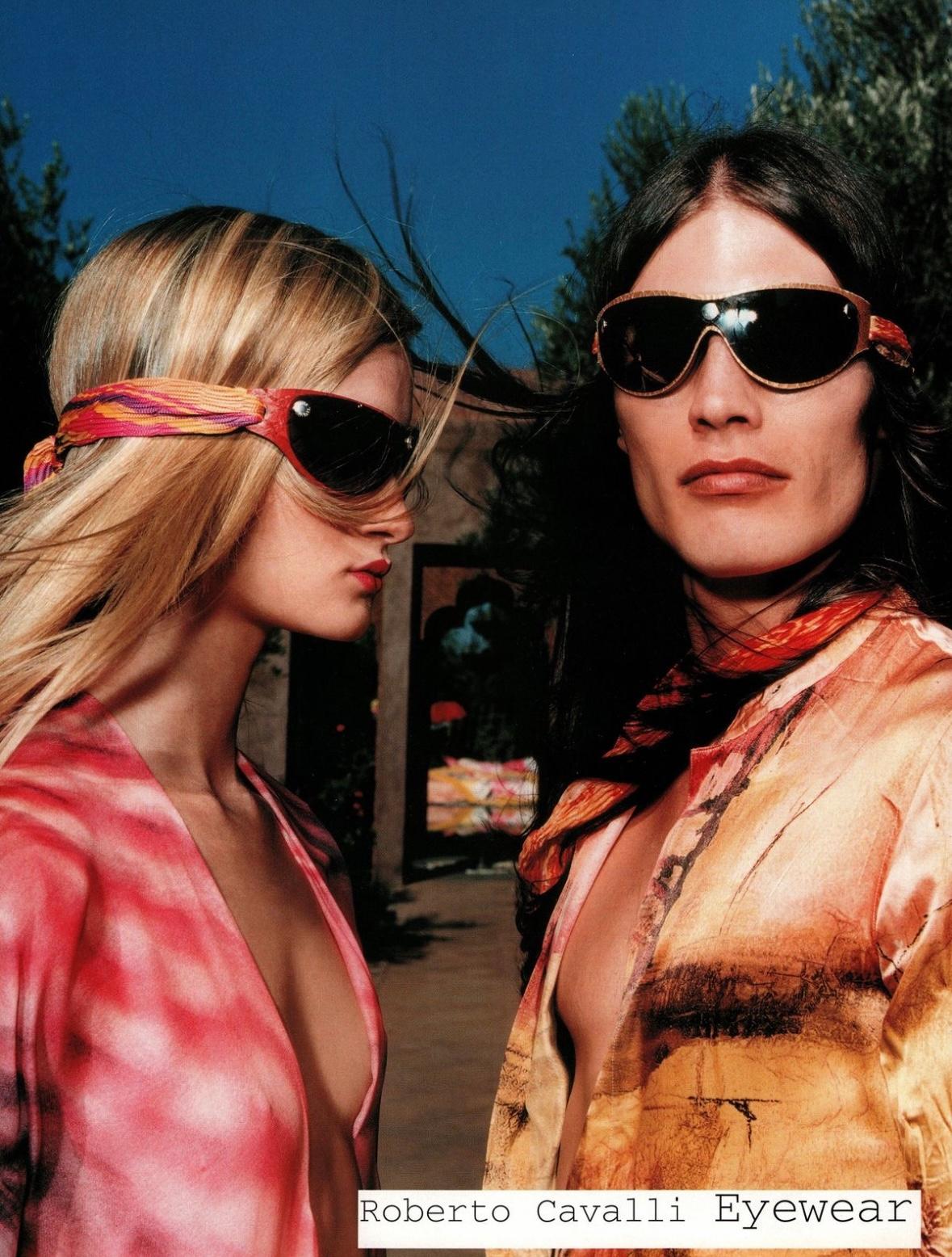 From the Spring/Summer 2001 collection, similar sunnies to these light blue Roberto Cavalli shield sunglasses were highlighted in the season’s ad campaign. These unique sunglasses feature a leather frame and a removable snap-on blue shield lens,