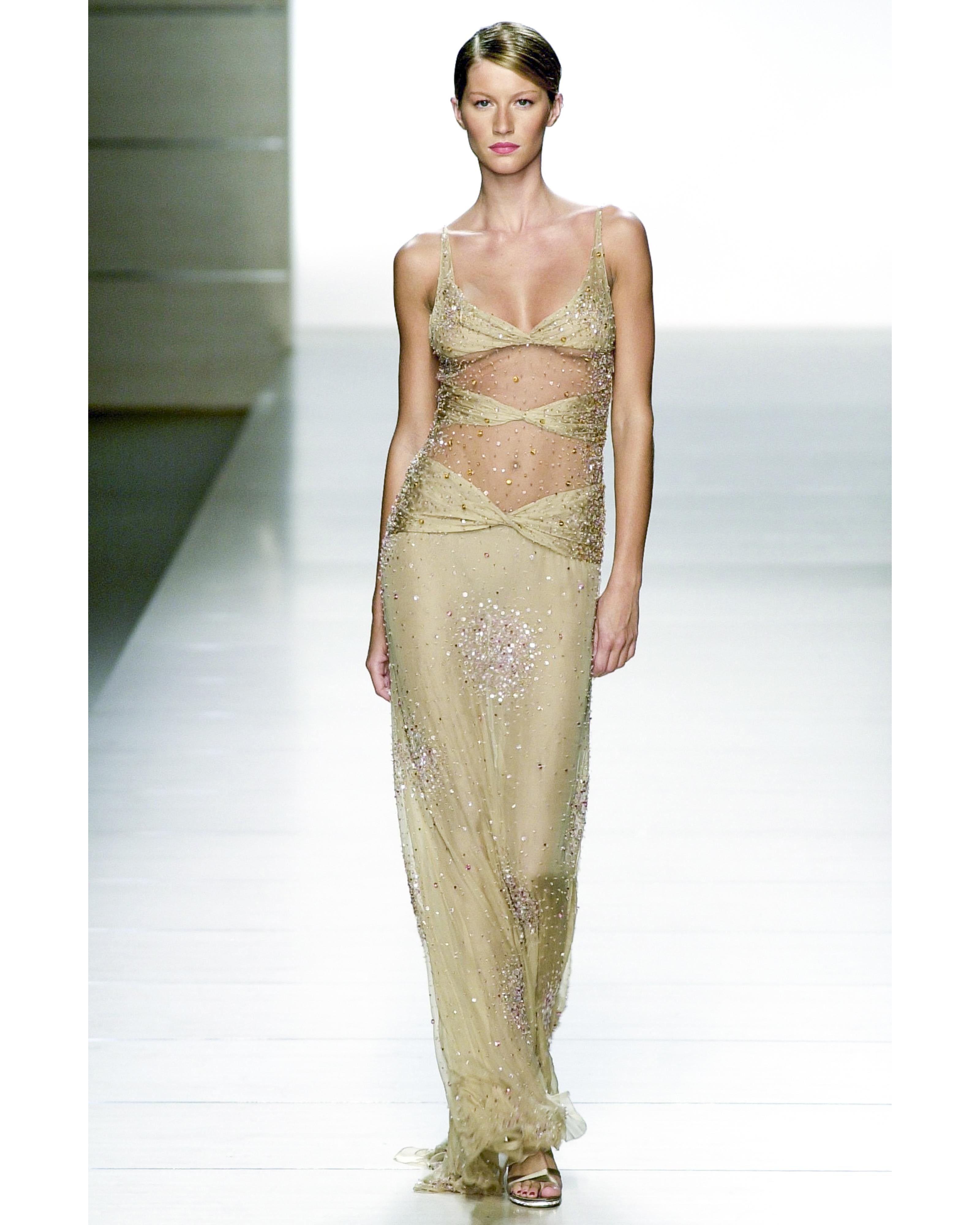 S/S 2001 Valentino mesh and silk tan embellished gown. Sleeveless spaghetti strap slip gown with mesh paneling at upper, with full embellishments throughout. Upper bustier portion has relatively small cups in order to reveal slight under-boob.