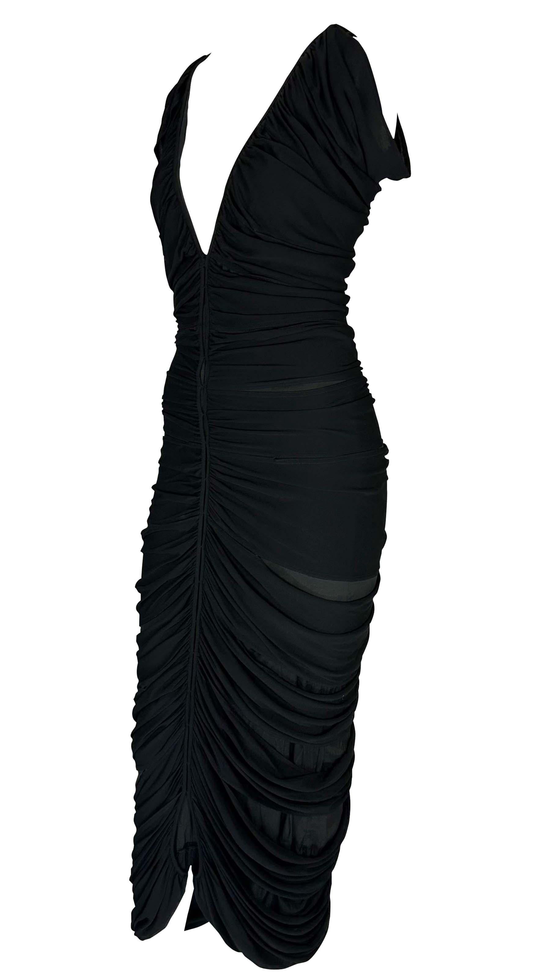 Presenting an incredible black Yves Saint Laurent Rive Gauche slinky dress, designed by Tom Ford. From the Spring/Summer 2001 collection, this fabulous dress is constructed of an interior slip and a masterfully designed ruched exterior. The dress