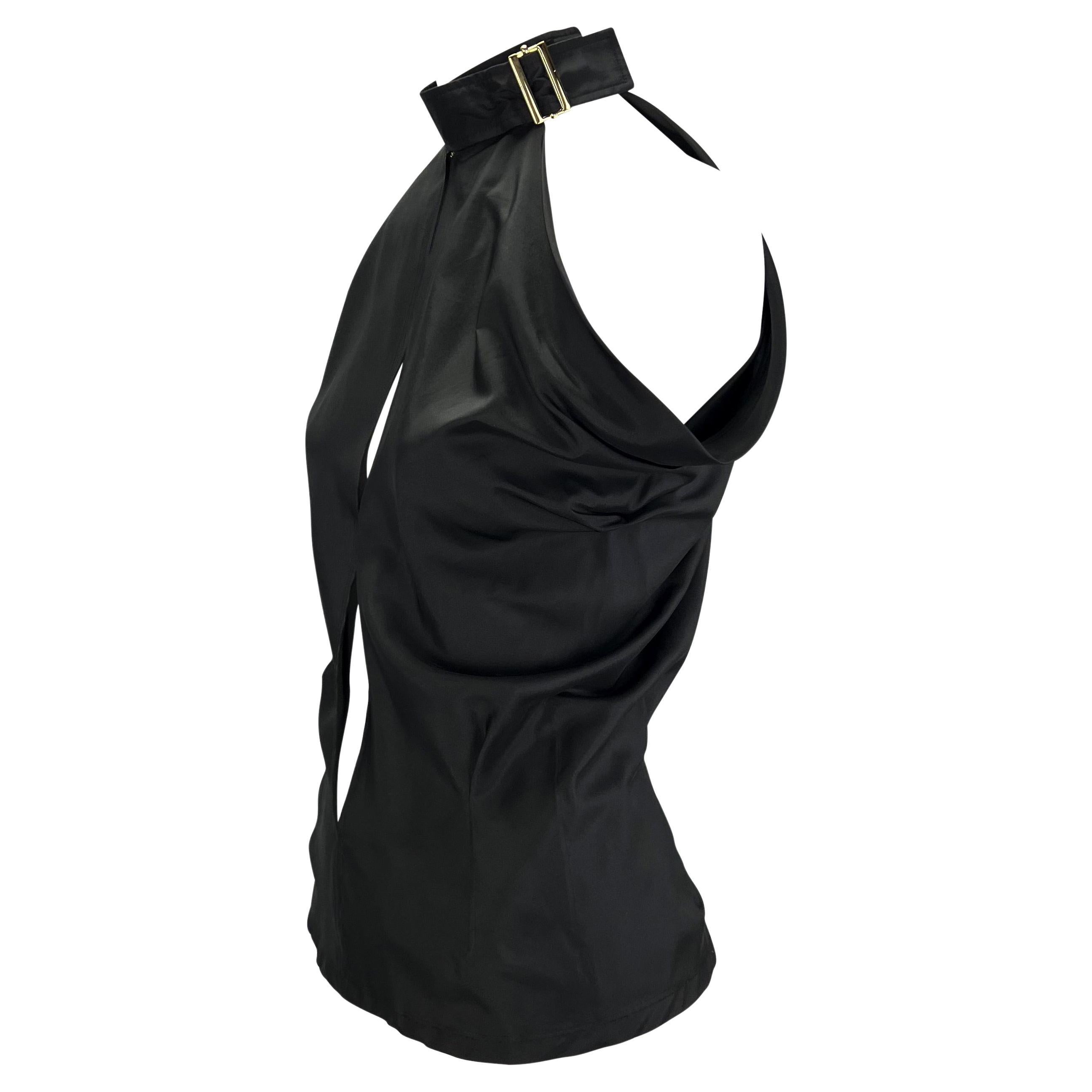 Presenting a gorgeous black silk plunging Yves Saint Laurent Rive Gauche top, designed by Tom Ford. From the Spring/Summer 2001 collection, this top features a ribbon collar with a gold accent buckle, gathered fabric at the underarms, and eyelets at