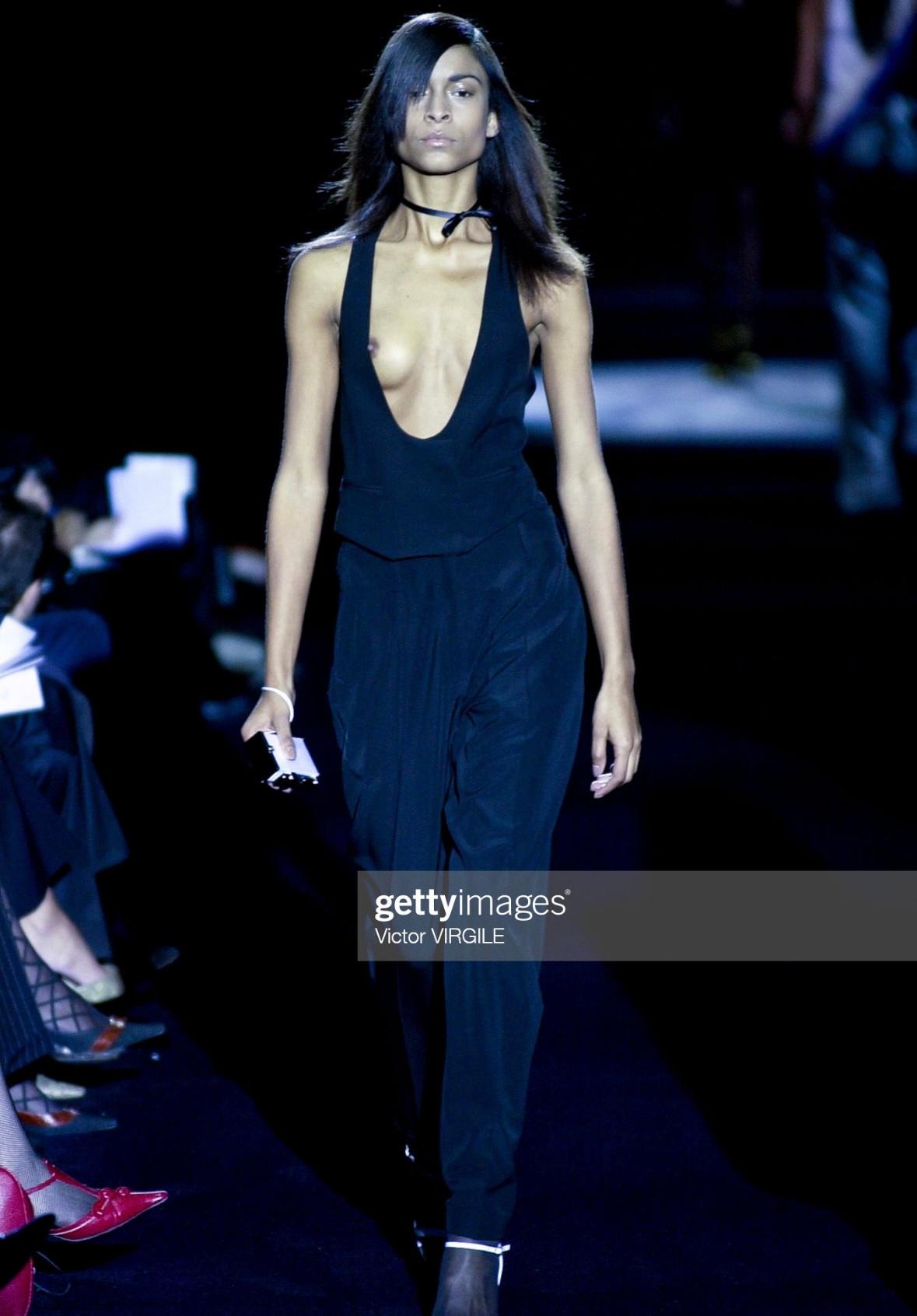 Presenting a stunning black Yves Saint Laurent Rive Gauche vest top, designed by Tom Ford. From Ford's first collection at YSL, this Spring/Summer 2001 collection top debuted on the season's runway as part of look 5. This ultra-chic top features a