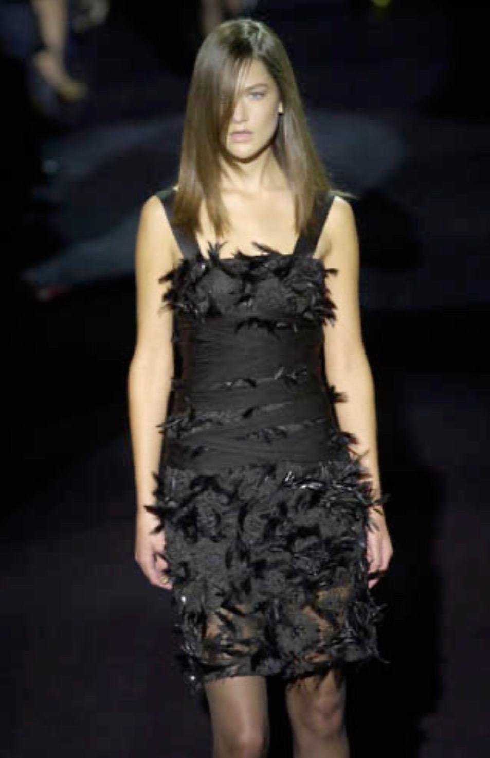 Presenting an absolutely incredible black beaded and feathered Yves Saint Laurent Rive Gauche dress, designed by Tom Ford. From Ford's inaugural collection with YSL, this dress debuted on the Spring/Summer 2001 runway as look 41 modeled by Zoe