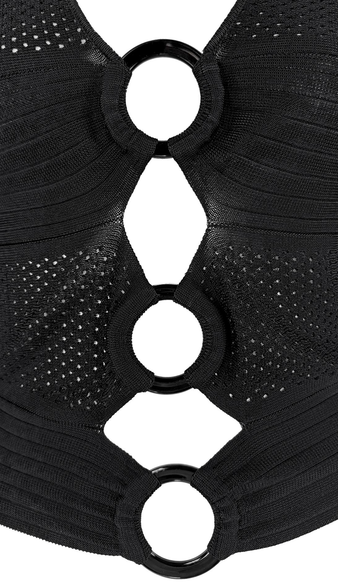 From Christian Dior's Spring/Summer 2002 collection by John Galliano, this black sleeveless top features a perforated knit construction with horizontal paneling. The front is designed with three rings that create dramatic cut-outs. The deep plunging