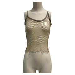 S/S 2002 Dolce 
Gabbana J-Lo top de rejilla con Swarovski