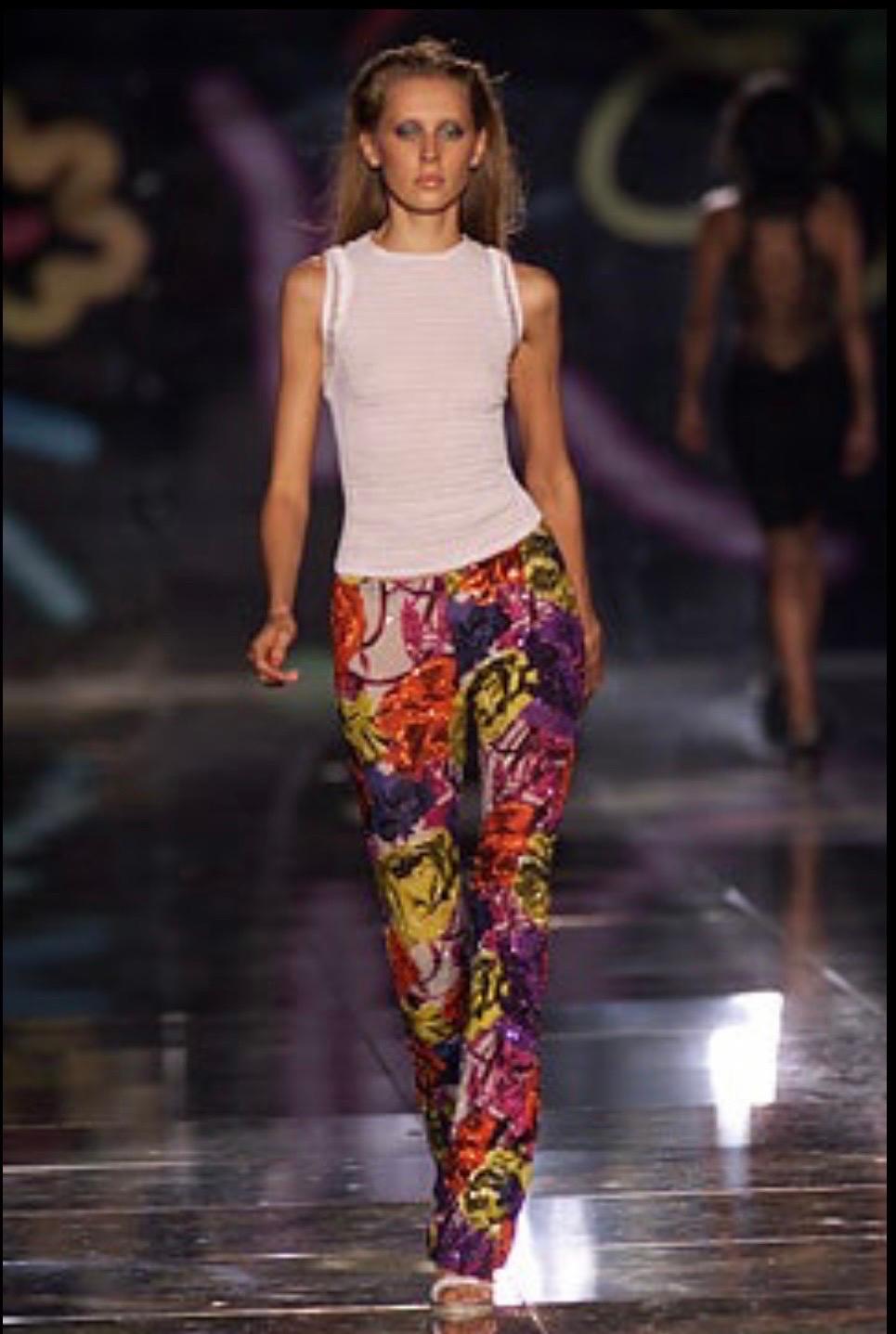 Gianni Versace Couture vivid eye-catching floral printed beaded pants from the Spring Summer 2002 collection designed by Donatella Versace.
Intricate beaded embellishments on the lower portion of the pants.
Made in Italy
Zip back closure

Size: