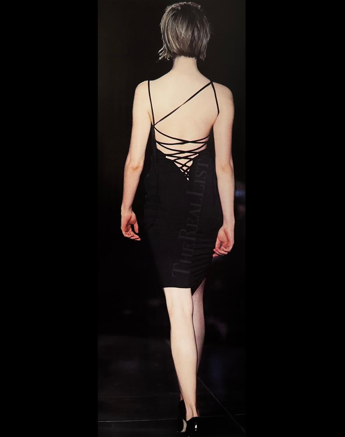 Presenting a vibrant floral lace-up Gianni Versace Couture dress designed by Donatella Versace. From the Spring/Summer 2002 collection, this dress debuted in all black on the season's runway as Look 42, modeled by Nina Heimlich. From the front, this