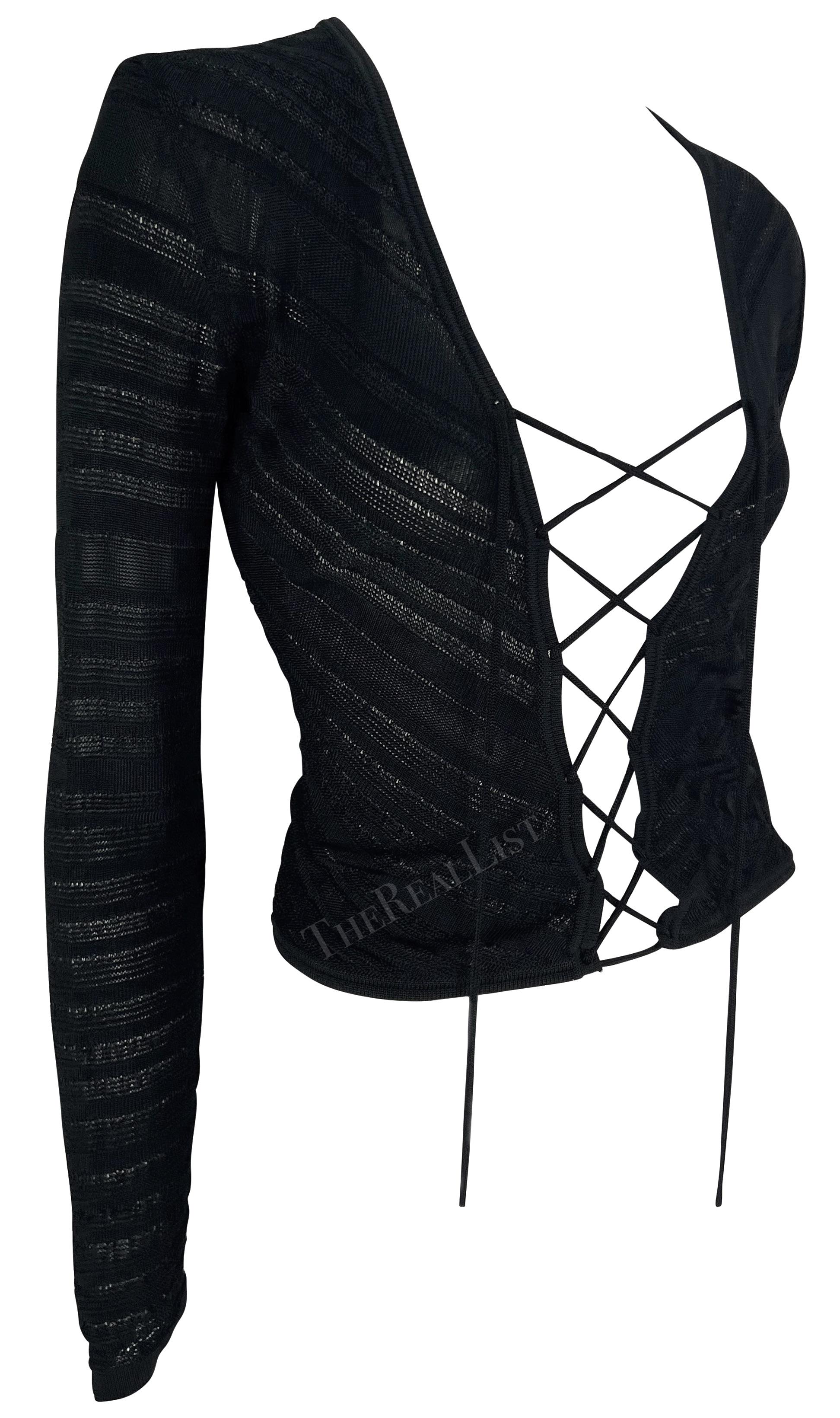 This fabulous black knit Gianni Versace cardigan was designed by Donatella Versace. From the Spring/Summer 2002 collection, this lightweight knit sweater is semi-sheer and features a lace-up closure at the front. Add this perfectly sexy Gianni