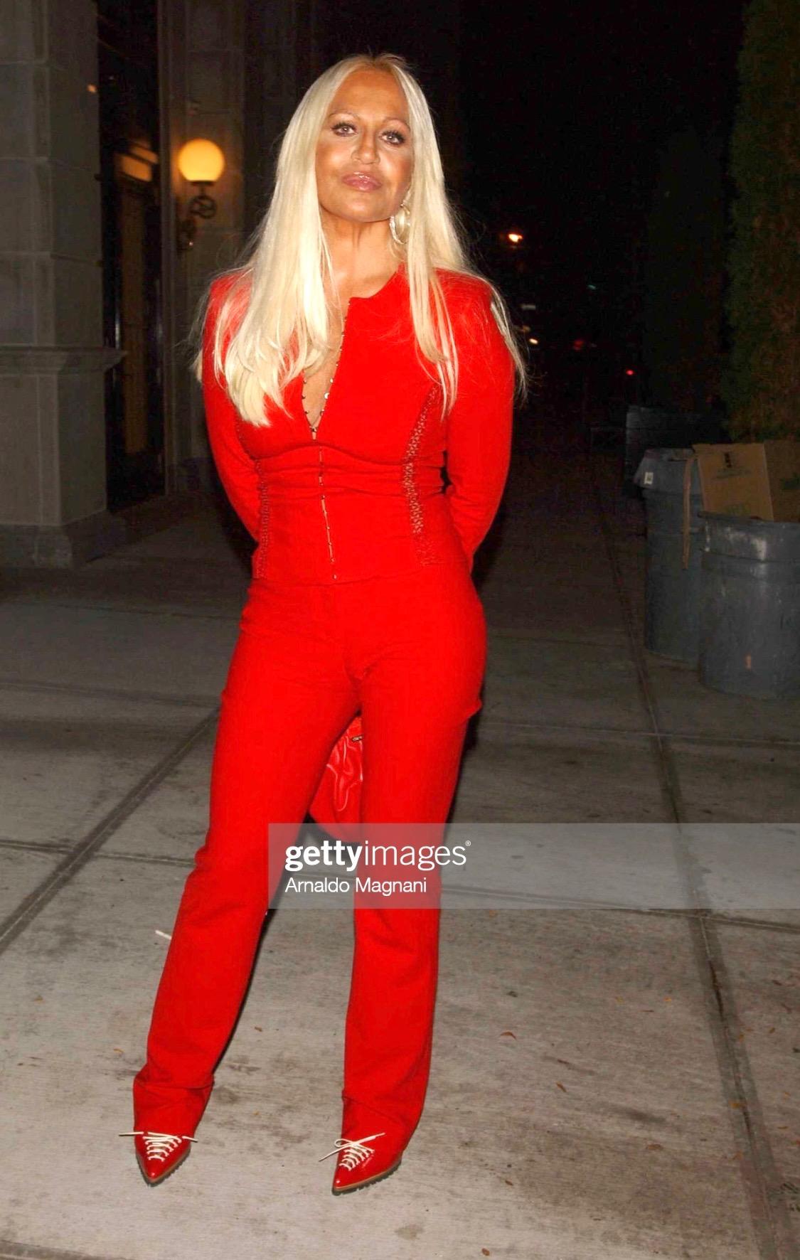 Presenting a red-hot pantsuit designed by Donatella for the Gianni Versace Spring/Summer 2002 collection. This look debuted as look number 3 on Inga Savits and on Donatella Versace for the launch party for Versace's skincare line at Barney's in