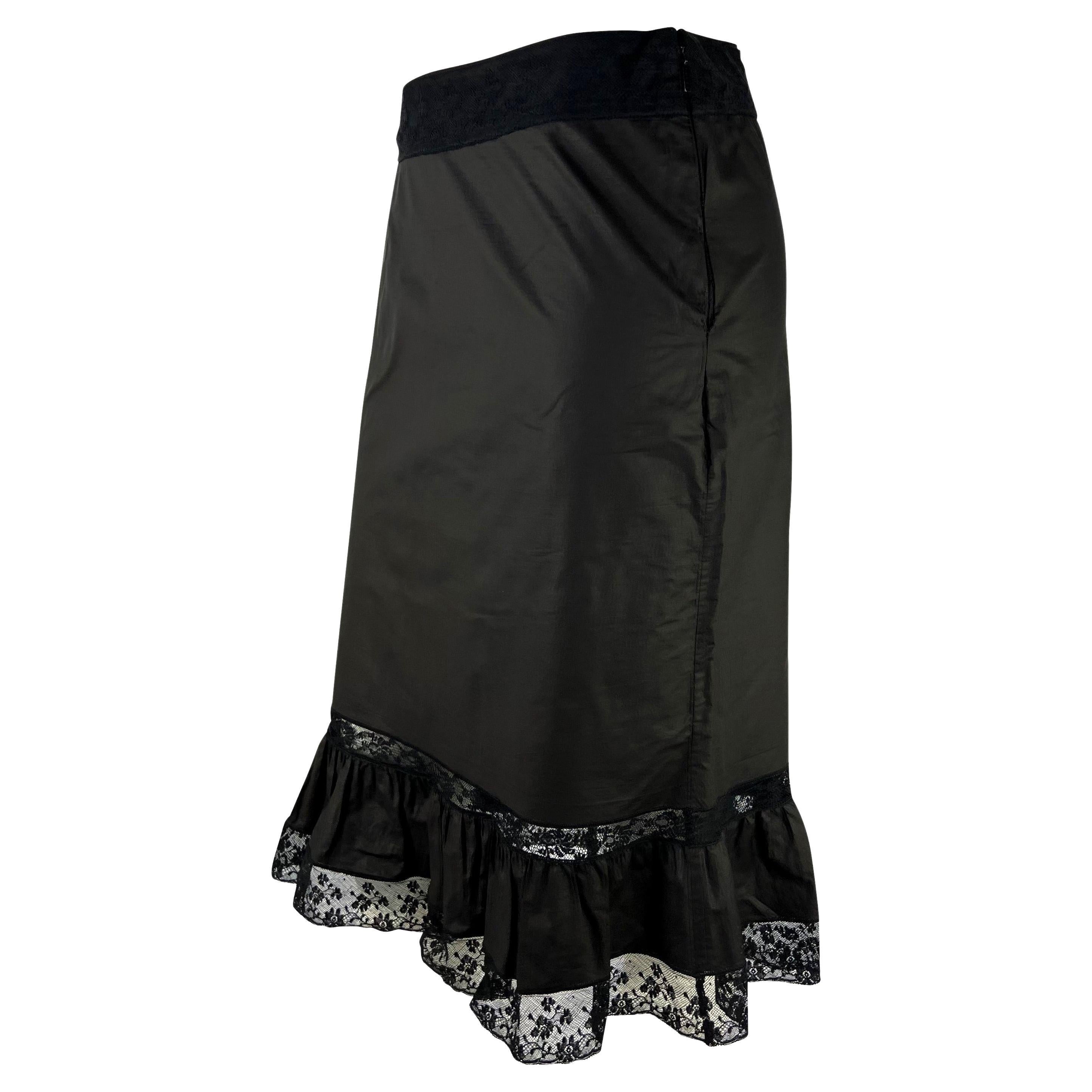 Presenting a black lace ruffle trim Gucci skirt, designed by Tom Ford. From the Spring/Summer 2002 collection, this lightweight skirt features a ruffle hem with lace details. 

Approximate measurements:
Size - IT42
31