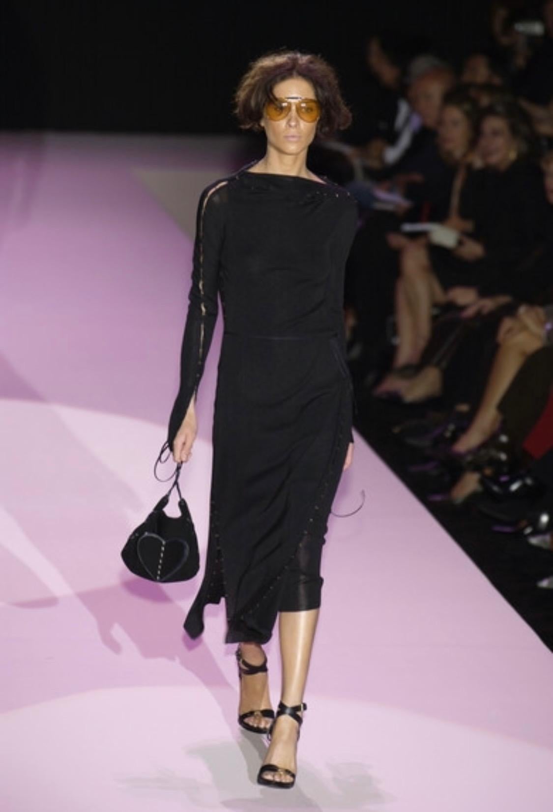 Presenting a slinky hook and eye closure accented sweater dress set designed by Tom Ford for Gucci's Spring/Summer 2002 collection. This set debuted as look number 23 on Erin Wasson on the Spring/Summer 2002 runway and was seen on Debra Messing at