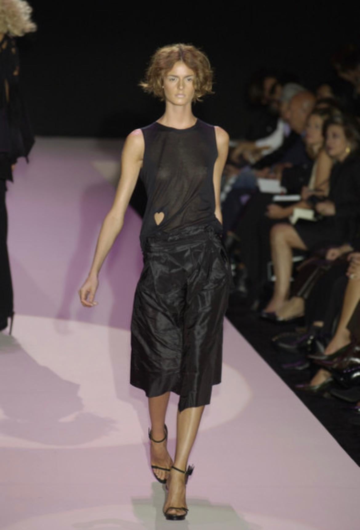 Presenting a black silk taffeta Gucci skirt, designed by Tom Ford. From the Spring/Summer 2002 collection, this skirt debuted on the season's runway as part of look 33, modeled by Jacquetta Wheeler. This voluminous skirt is constructed of