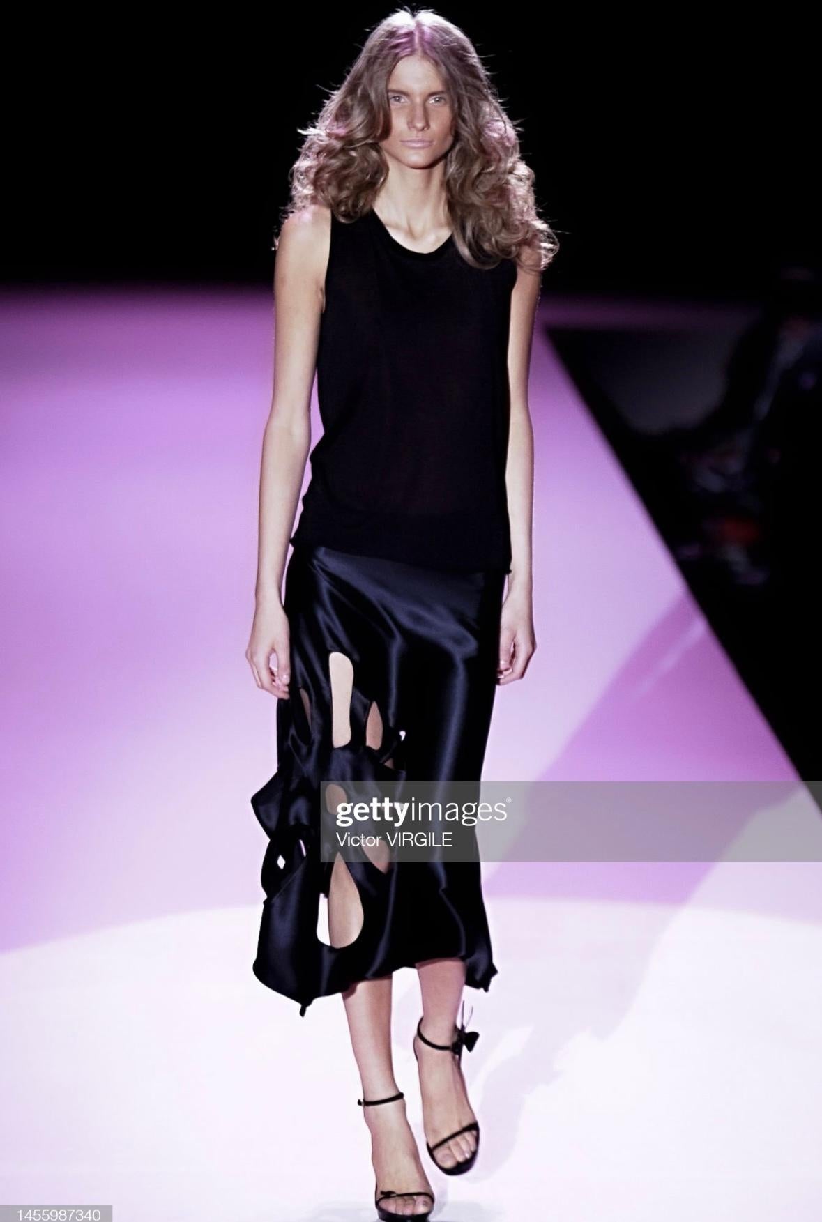 Presenting a fabulous tan suede Gucci midi skirt, designed by Tom Ford. From the Spring/Summer 2002 collection, the black satin version of this skirt debuted on the season's runway as part of look 31. Constructed entirely of suede, this flared skirt