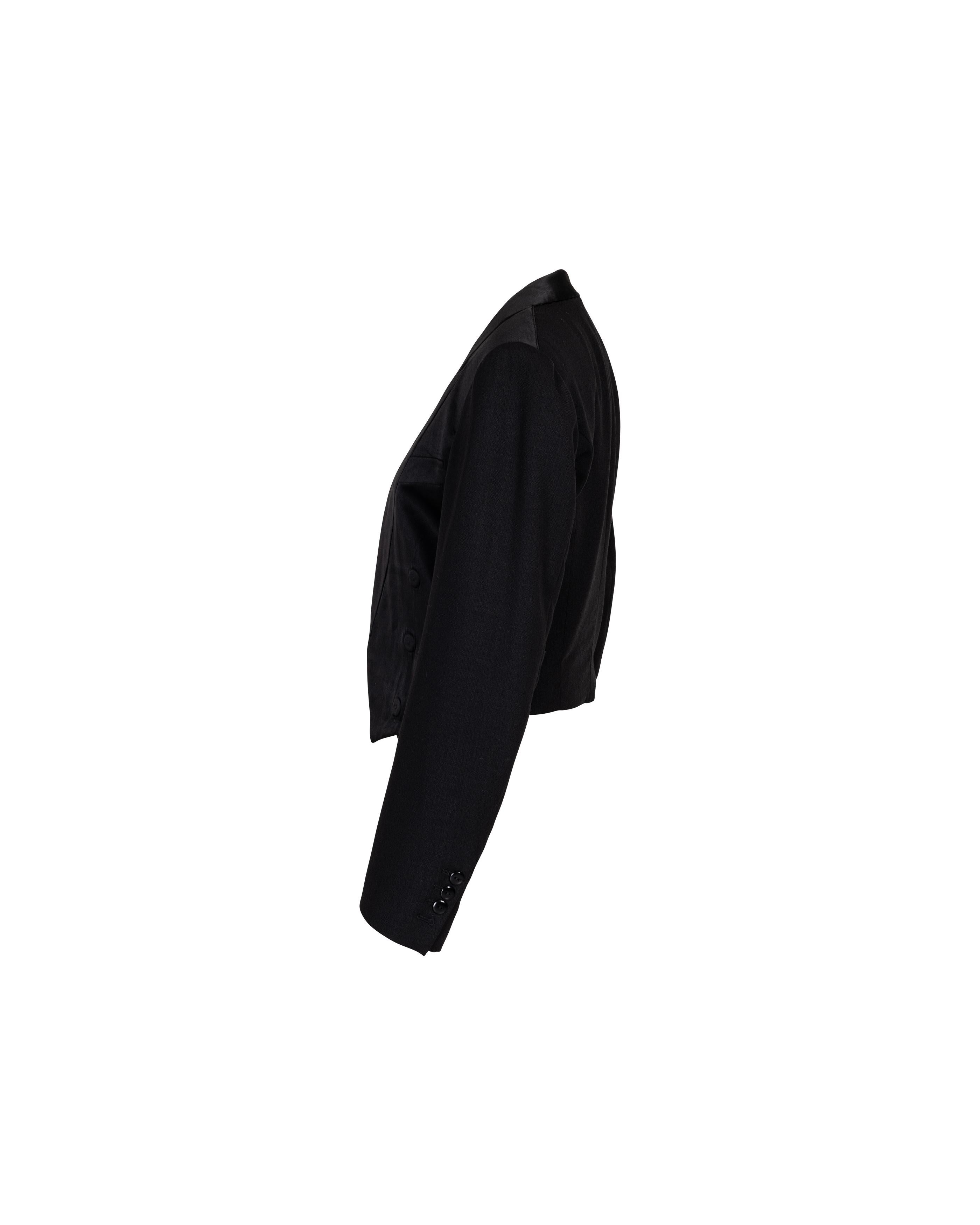 S/S 2002 Maison Martin Margiela black cropped wool long sleeve tuxedo blazer jacket. Cropped jacket with fully built-in connected flat illusion lapel and triple button detail on both sides of waist. Interior single button closure. Fabric Contents: