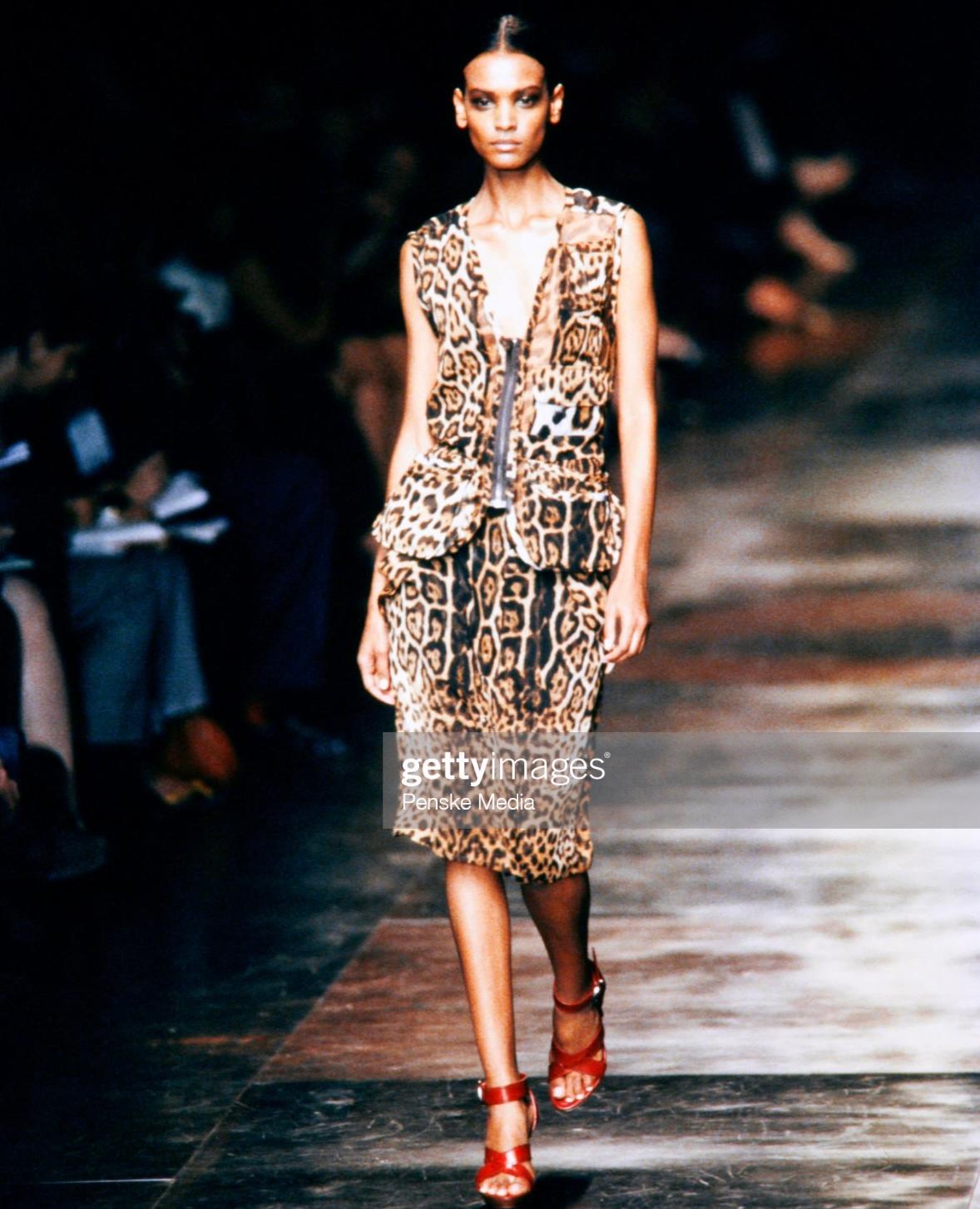 Presenting the opening look from the Spring/Summer 2002 Yves Saint Laurent Rive Gauche runway collection designed by Tom Ford and worn by Liya Kebede. Constructed of sheer cheetah printed silk with the YSL monogram logo peppered throughout, this set