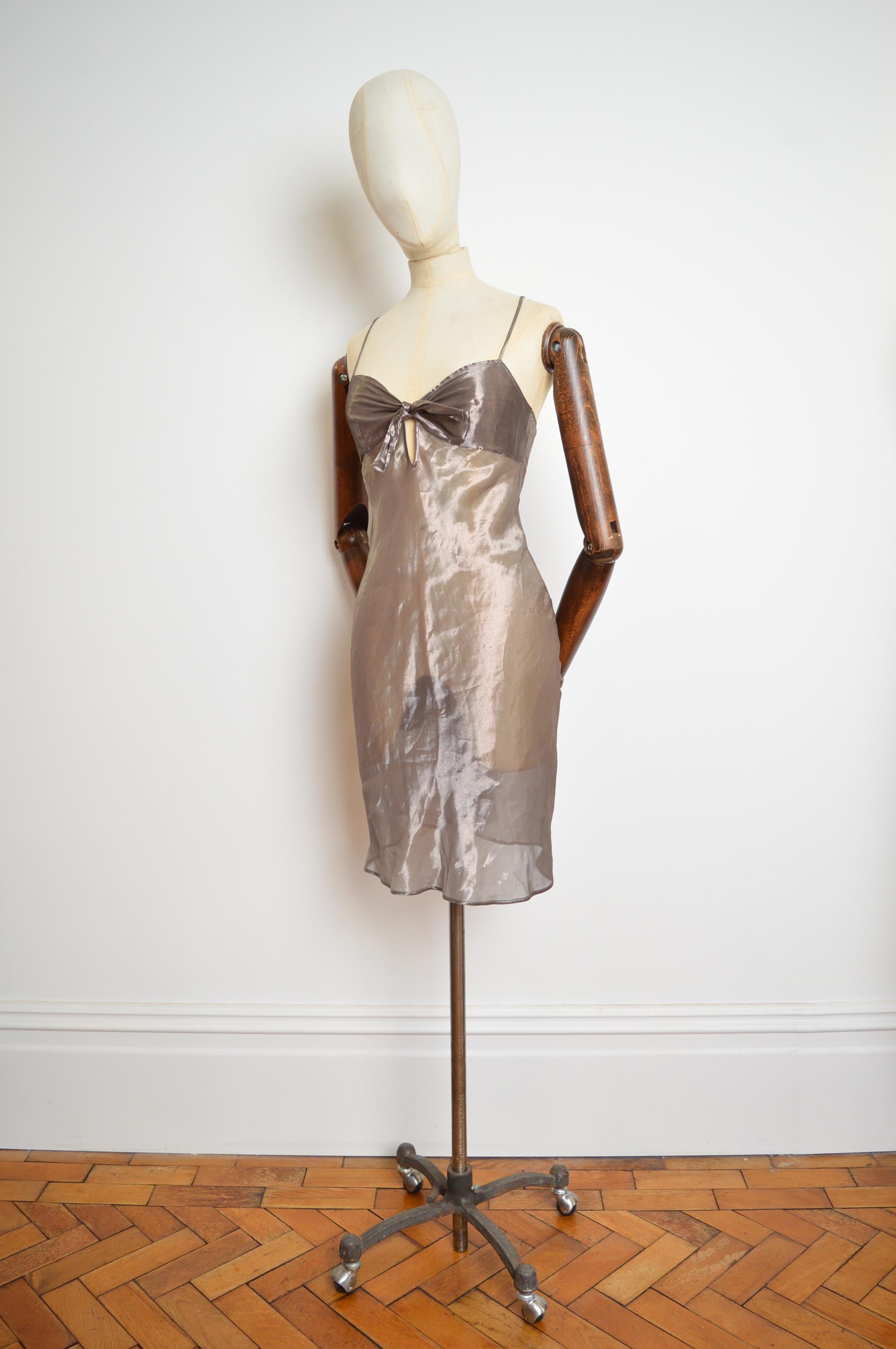 A Sublime vintage slip dress from Christian Dior's Spring / Summer 2003 Collection designed by John Galliano crafted from a sheer silver/ nude toned silk blended material.

MADE IN ITALY.  

Measurements are provided in Inches.  
Please note the