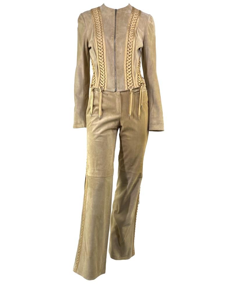 Presenting a luxurious suede jacket and pant set designed by John Galliano for Christian Dior's Spring/Summer 2003 collection. Seldom found as a set, these pieces feature tonal corset lace-up accents covering the jacket and each side of the pant