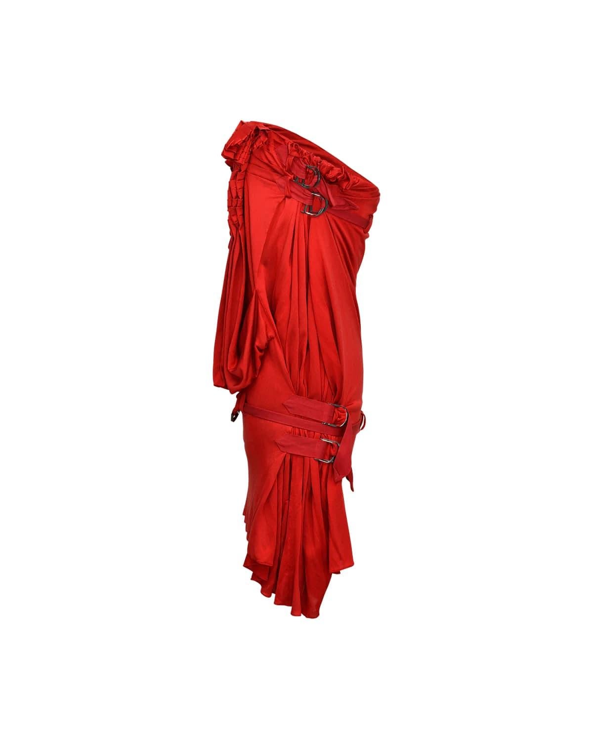 Christian Dior by Galliano strapless red dress with draped front paneling, ruched side and bottom panels and strappy, hanging “D” for Dior details that wrap around the back of the dress. Dress is a mini length. Look 43 on the runway worn by