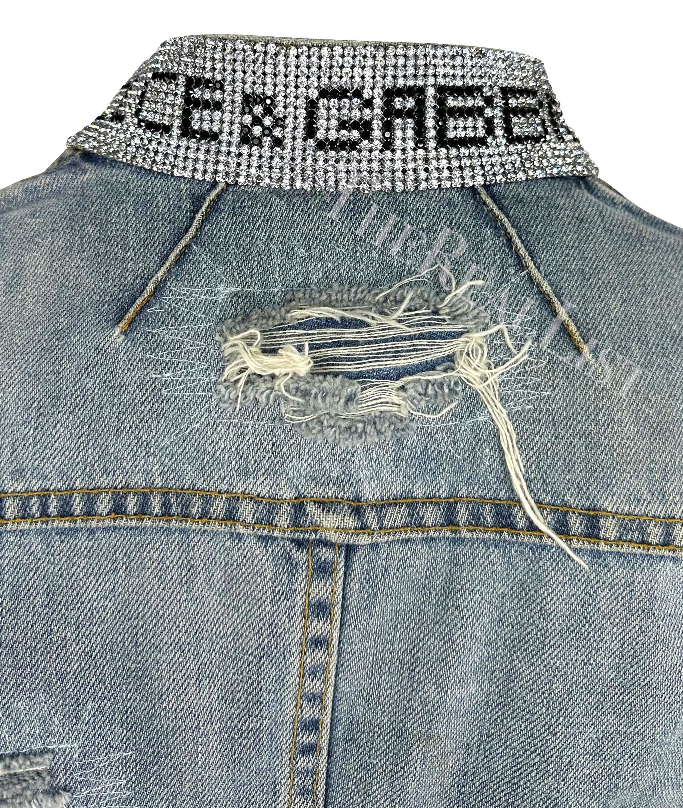 Presenting a distressed Dolce and Gabbana denim jacket. From the Spring/Summer 2003 ‘Sex and Love’ collection, this light wash denim jacket features cropped sleeves, intentionally distressed details throughout, hook closures, and is made complete