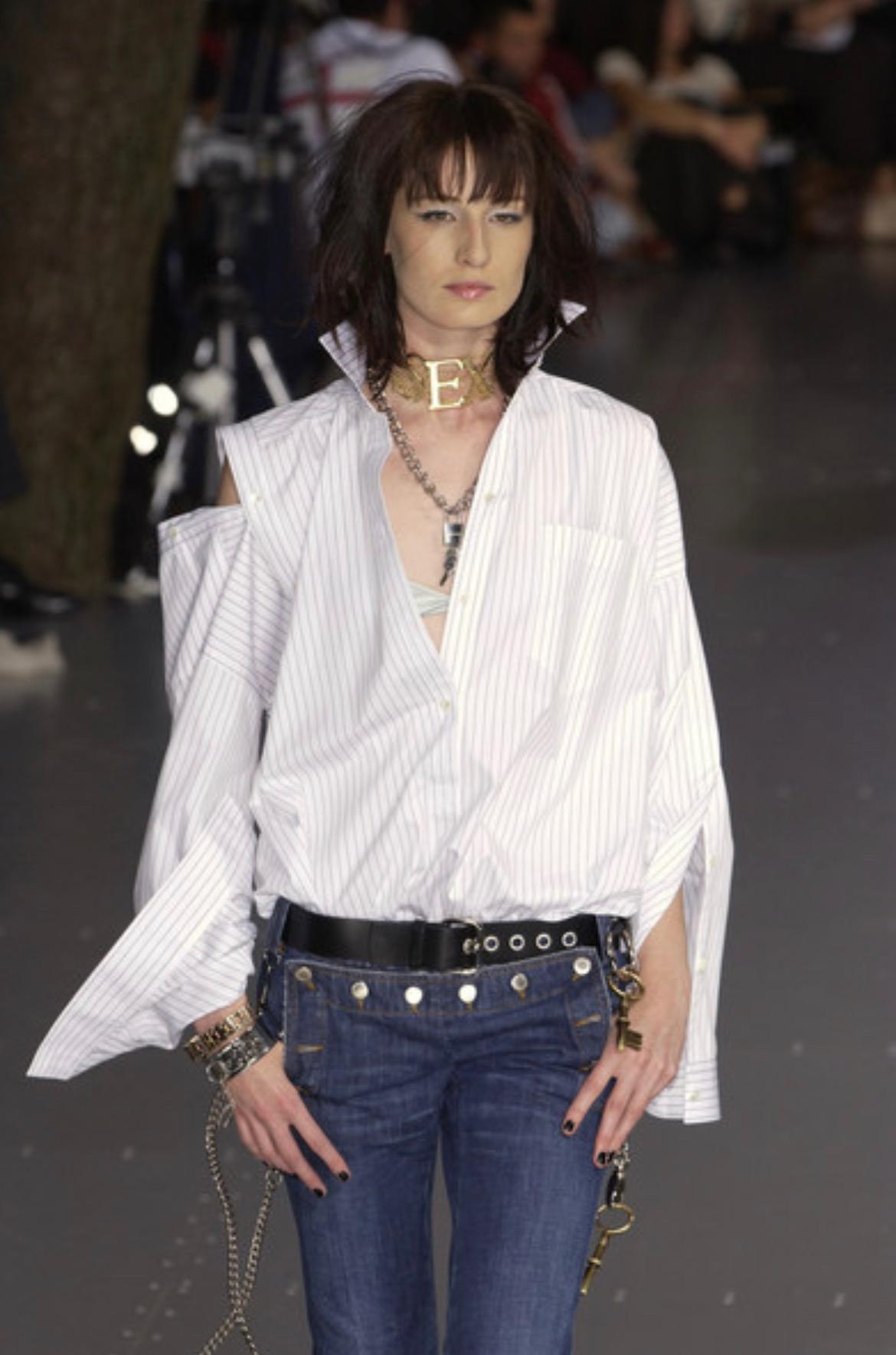 Presenting a stunning black leather and silver-tone metal Dolce and Gabbana belt. From the Fall/Winter 2003 collection, this belt debuted on the season's runway as part of look 58, modeled by Erin O'Connor. This 'Sex and Love' collection belt is