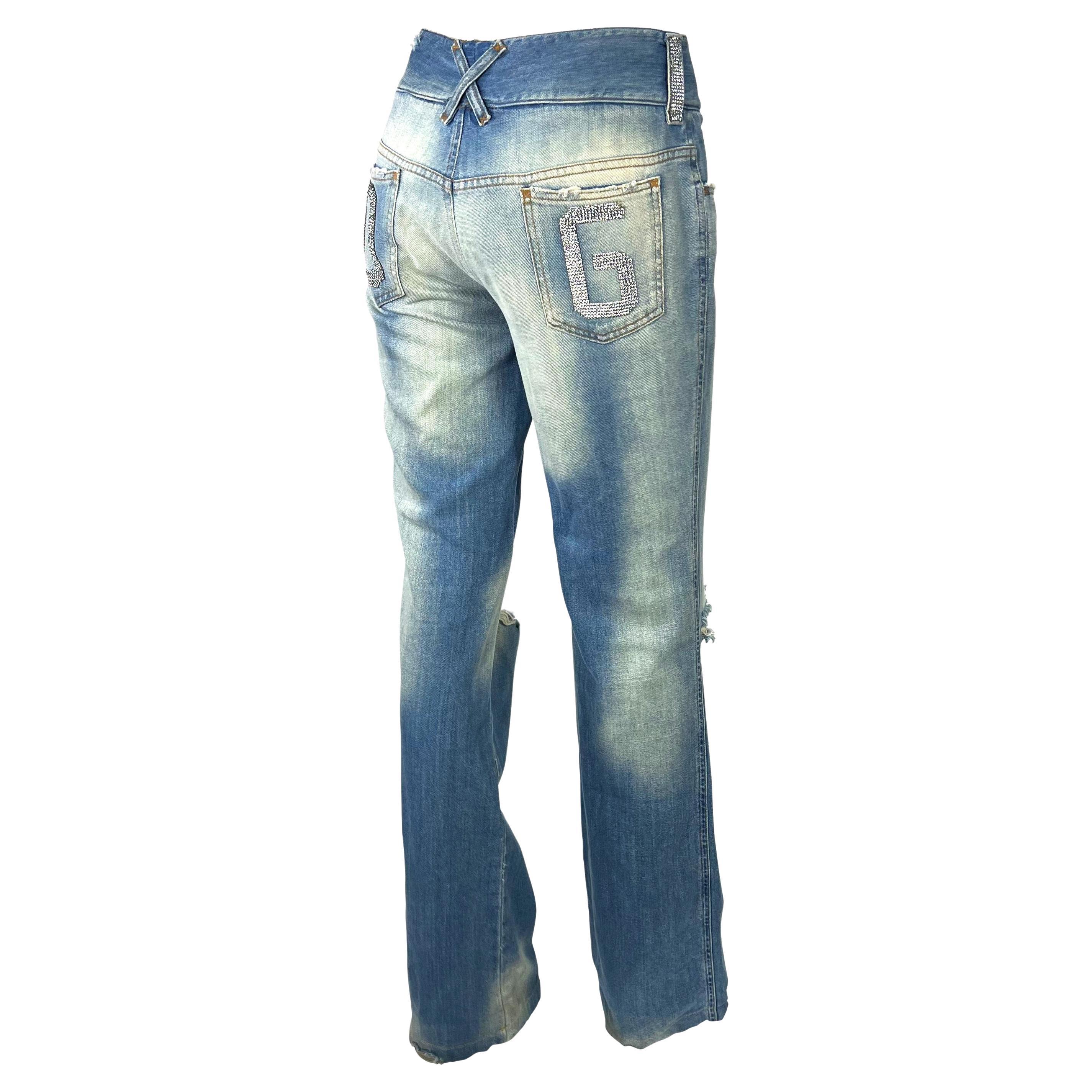 Presenting a fabulous pair of distressed low-rise Dolce and Gabbana jeans. From the Spring/Summer 2003 