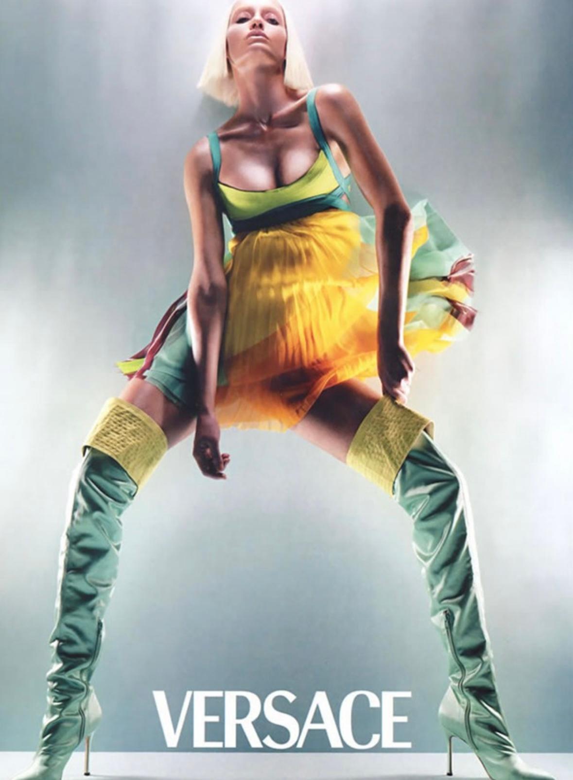 TheRealList presents: an iconic bright multicolor Gianni Versace mini dress, designed by Donatella Versace. From the Spring/Summer 2003 collection, this short dress debuted on the season's runway as look 5 modeled, by Michelle Alves. This fabulous