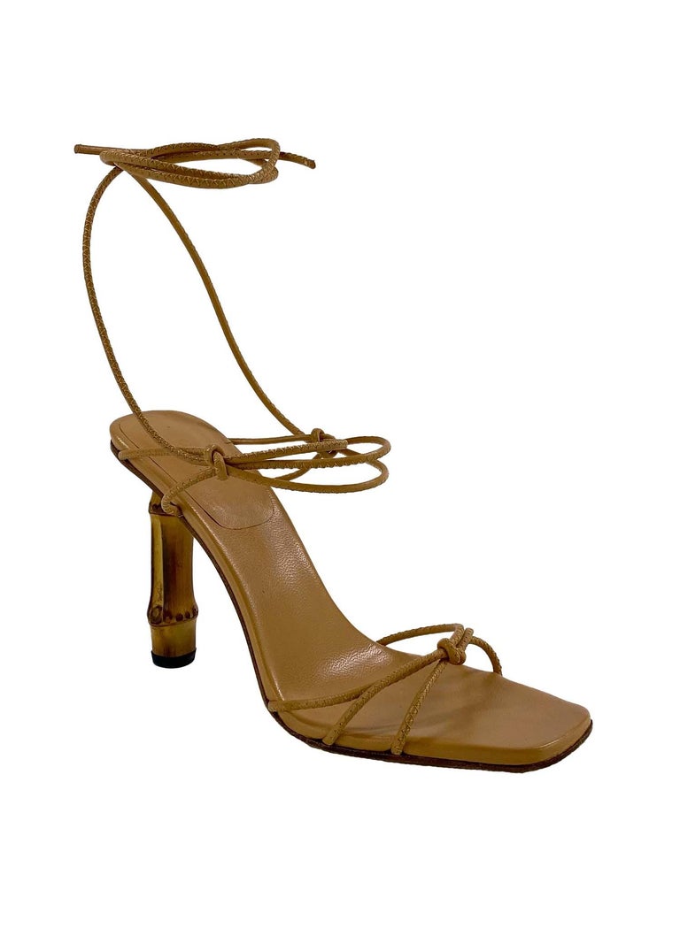 TheRealList presents: a sensual pair of leather wrapped Gucci bamboo heels, designed by Tom Ford. This stunning pair of shoes is part of Ford's Spring/Summer 2003 collection during his tenure at Gucci. These heels are made of a tan leather sole and