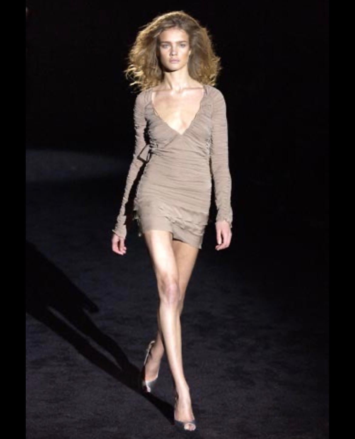TheRealList presents: an incredible dusty pink Gucci skirt set, designed by Tom Ford. From the Spring/Summer 2003 collection, a dress version of this set debuted on the season's runway as look 41, modeled by Natalia Vodianova and appeared in the