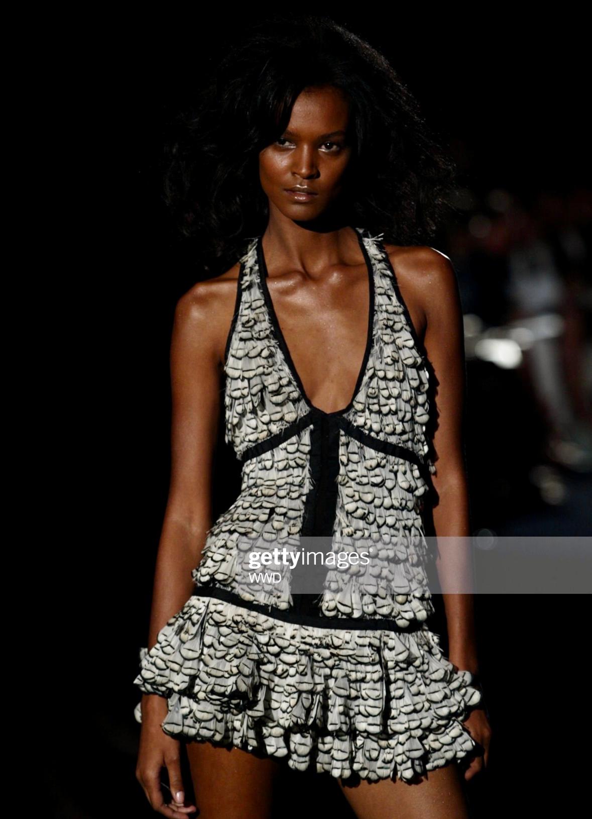 Presenting a stunning feather-embellished silk mini dress designed by Tom Ford for Gucci's Spring/Summer 2003 collection. This dress debuted on the runway as look number 26 on Liya Kebede and appeared on Renée Zellweger, photographed by Ruven