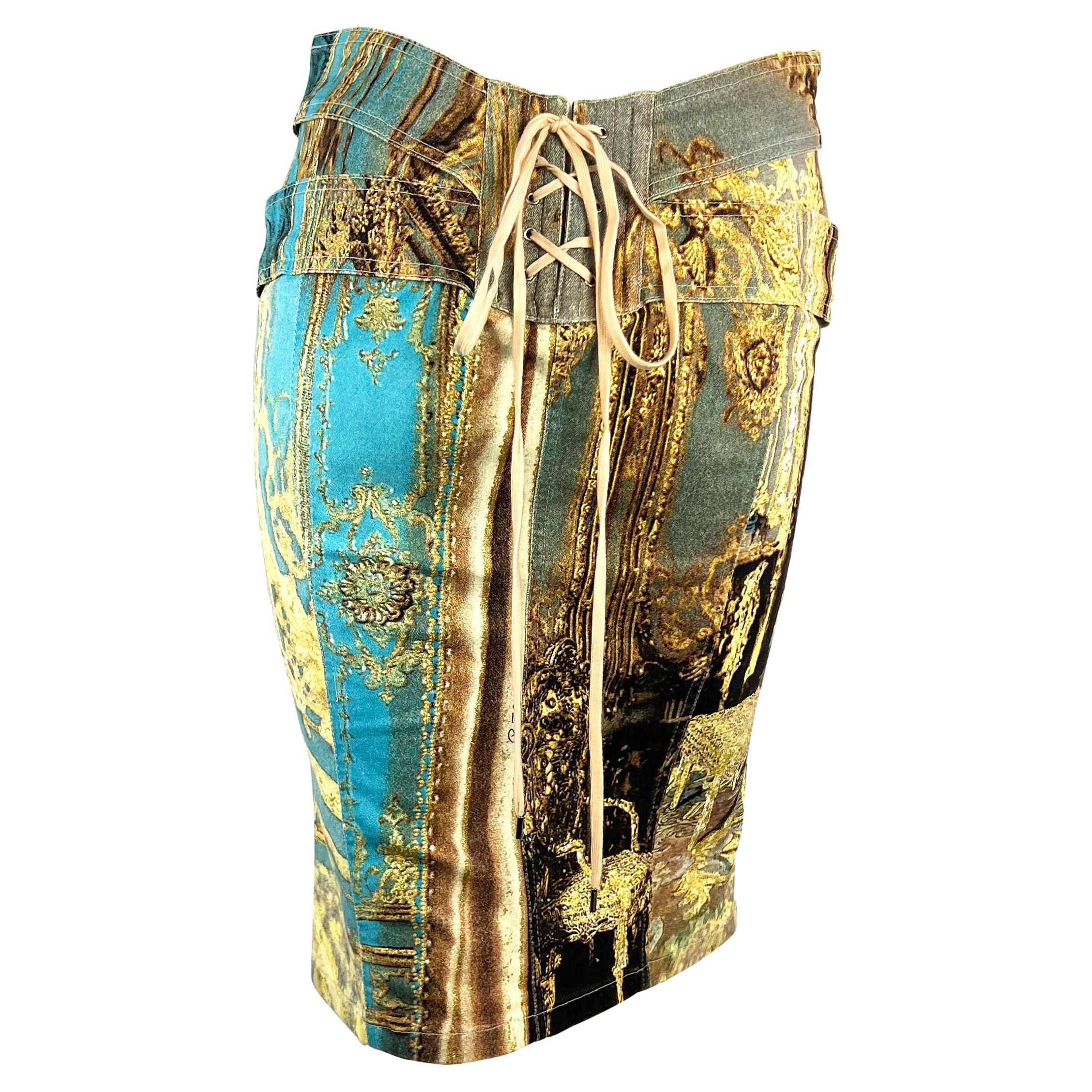 Presenting a stunning baroque Roberto Cavalli skirt. From Spring/Summer 2003, this skirt depicts a baroque style room with musical instruments. The skirt has matching baroque print straps at the hips which connect to a hook eye closure at the front