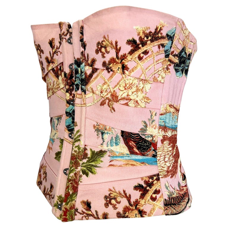 TheRealList presents: a fun and flirty corset top designed by Roberto Cavalli for his Spring/Summer 2003 collection. Featuring the season's iconic pink chinoiserie print, this boned corset laces up at the back for the perfect fit! Check out our