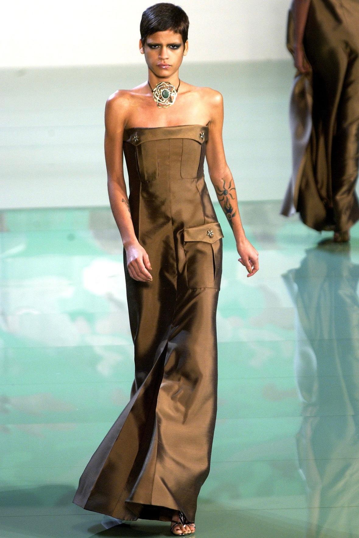 This fabulous green strapless Valentino gown was designed by Valentino Garavani for his Spring/Summer 2003 collection. Debuting as look 67 on Omahyra Mota, this gown perfectly captures the collection's military motif with functional cargo style