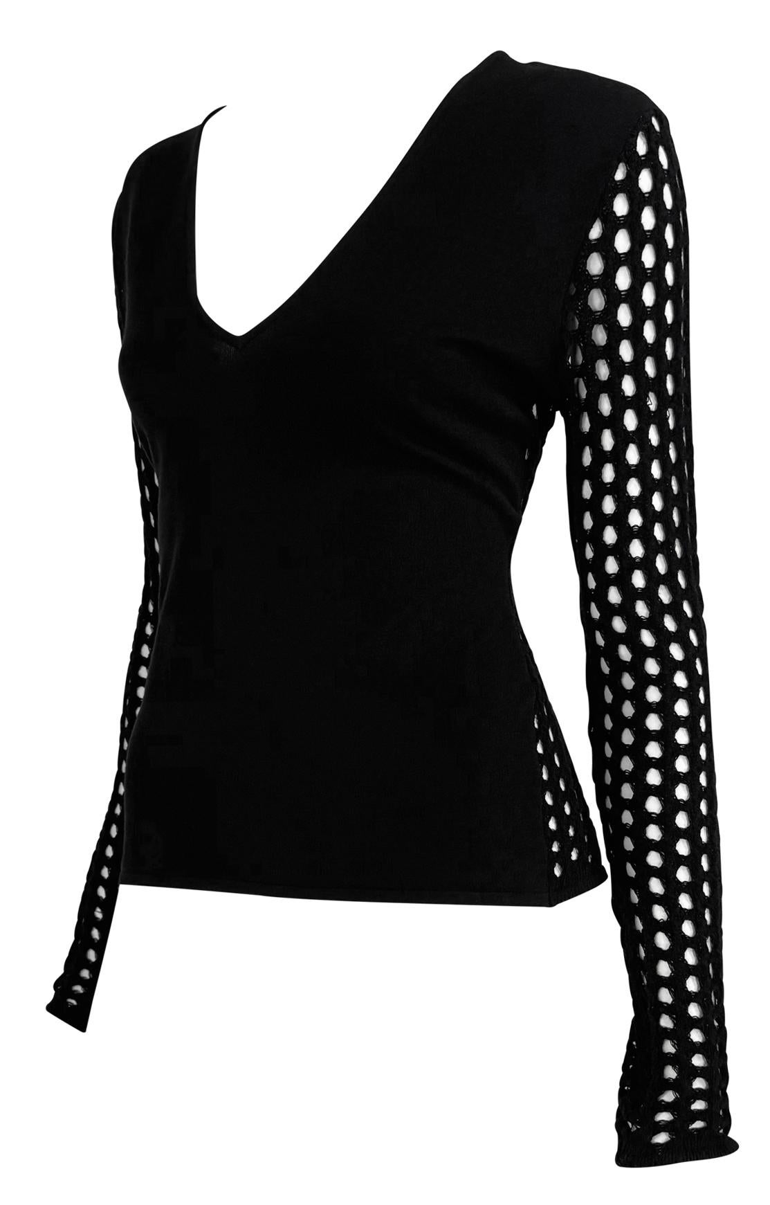 This black knit Versace sweater from Spring/Summer 2003 collection by Donatella features a V-neckline and fishnet-inspired sheer sleeves and back. 

Approximate measurements:
Size - 46IT/12US
Shoulder to hem: 21