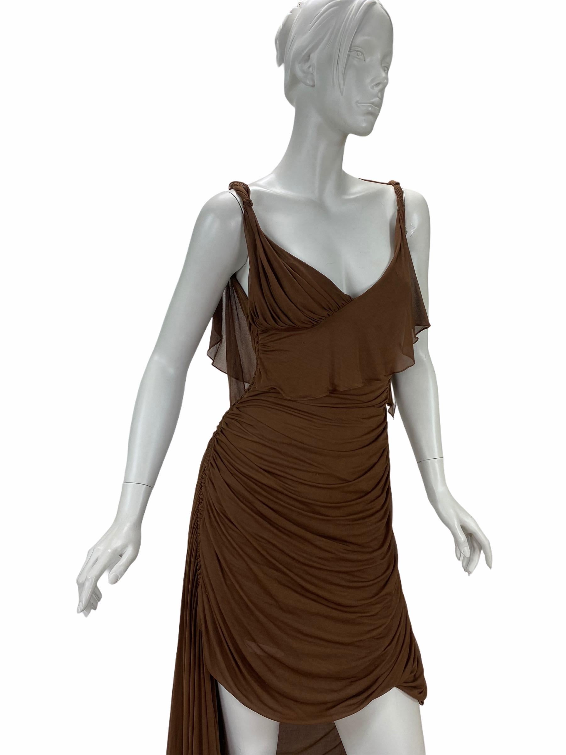 Imbued with feminine charm is a dress crafted
from Tom Ford’s imagination. Exclusively from the
2003 fall Gucci collection, it has been exhibited in
the Metropolitan Museum of Art for its flawless
craftsmanship. Composed of delicate silk in