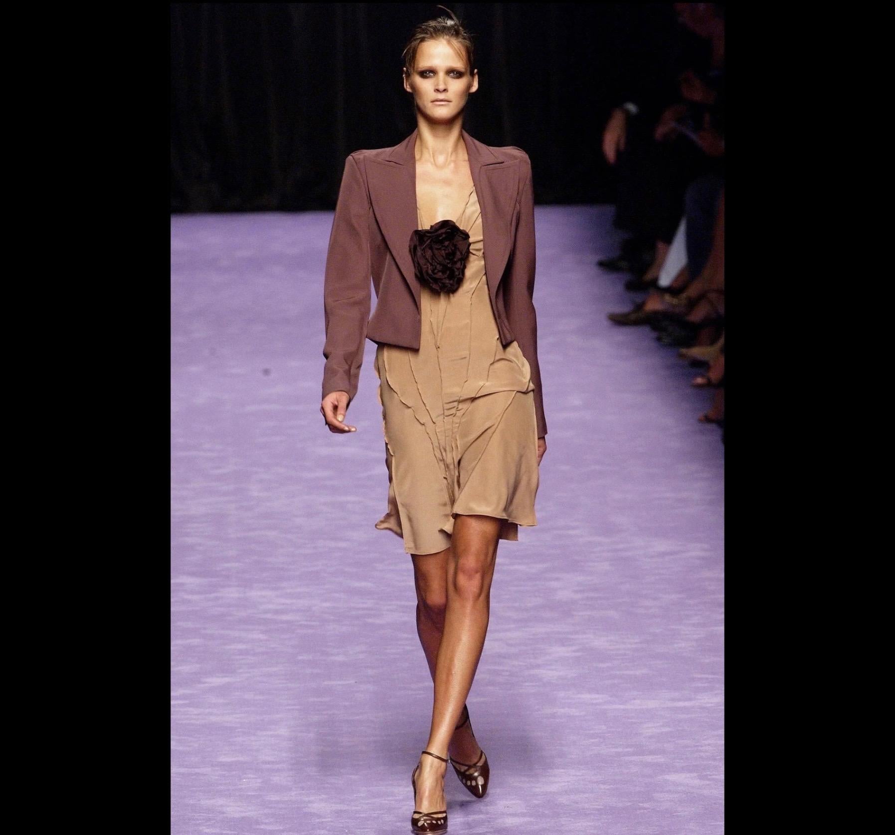 TheRealList presents: an incredible blush-colored Yves Saint Laurent Rive Gauche dress, designed by Tom Ford. From the Spring/Summer 2003 collection, this dress opened the season's runway as part of look 1 modeled by Carmen Kass. This fabulous dress