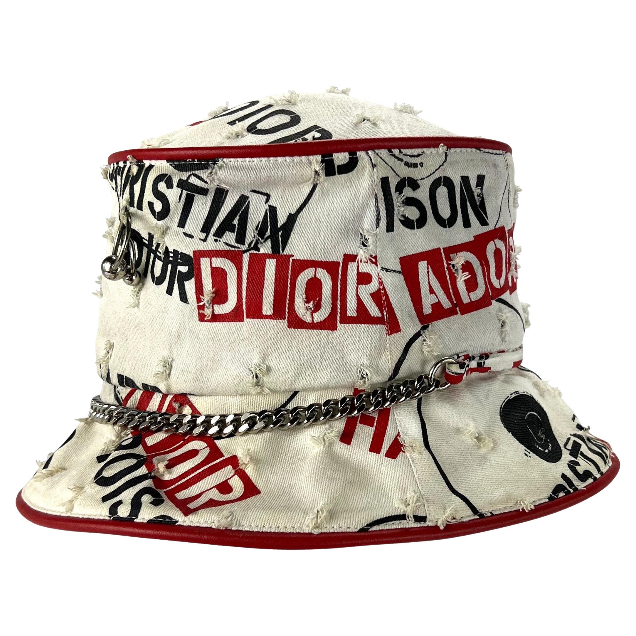 TheRealList presents: a fabulous 'hardcore' print Christian Dior Boutique bucket hat, designed by John Galliano. From the Spring/Summer 2004 collection, this hat features a red and black screen print pattern, piercings, tactful holes, and a chain