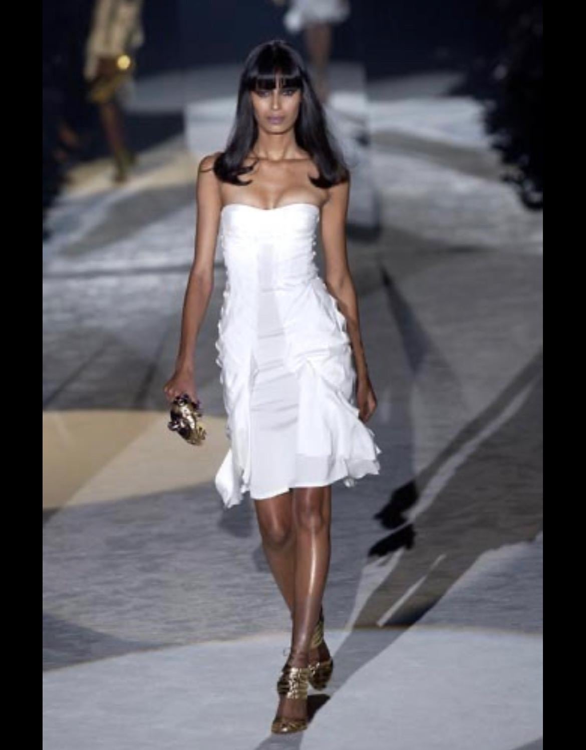 Presenting a fabulous black strapless Gucci dress, designed by Tom ford. From the Spring/Summer 2004 collection, this dress debuted in white on the season's runway as part of look 30 modeled by Ujjwala Raut. This incredible silk dress features