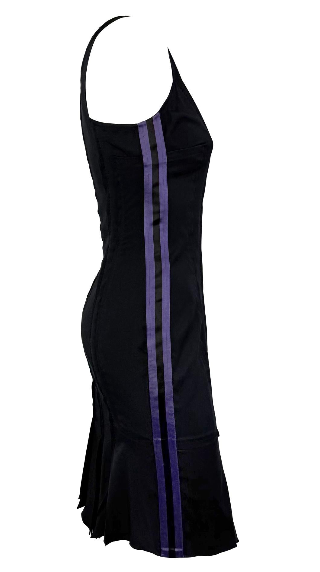 From Gucci’s Spring/Summer 2004 collection by Tom Ford, this black sleeveless dress features contouring seam detailing and bold purple satin stripes along the sides. The flared hem adds movement to the sleek, body-skimming silhouette.

Approximate