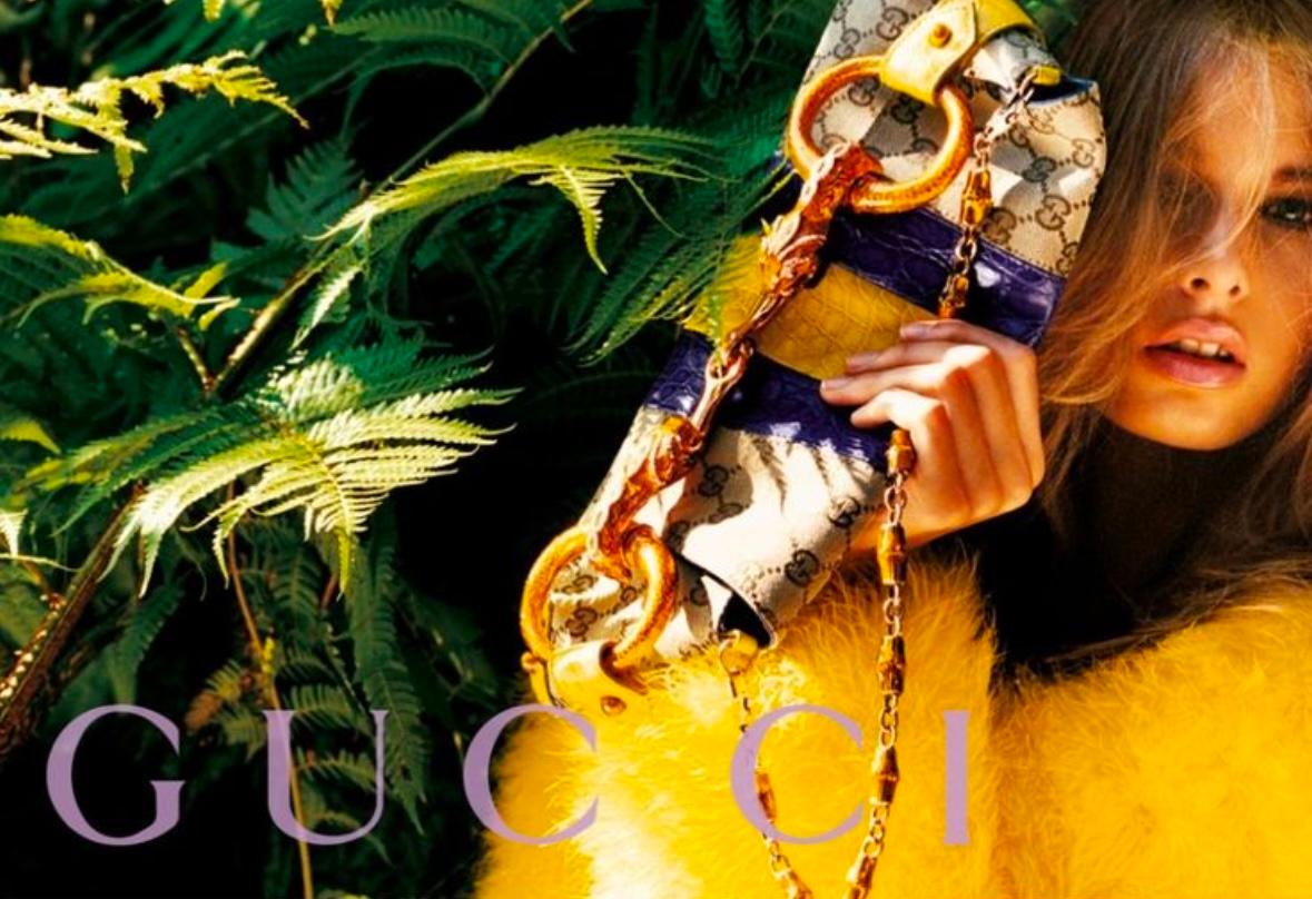 This Gucci by Tom Ford small shoulder bag from Spring/Summer 2004 is crafted from GG canvas with genuine alligator leather accents in bold yellow and purple tones. Multiple bags and accessories with these bold alligator and enamel accents debutd in