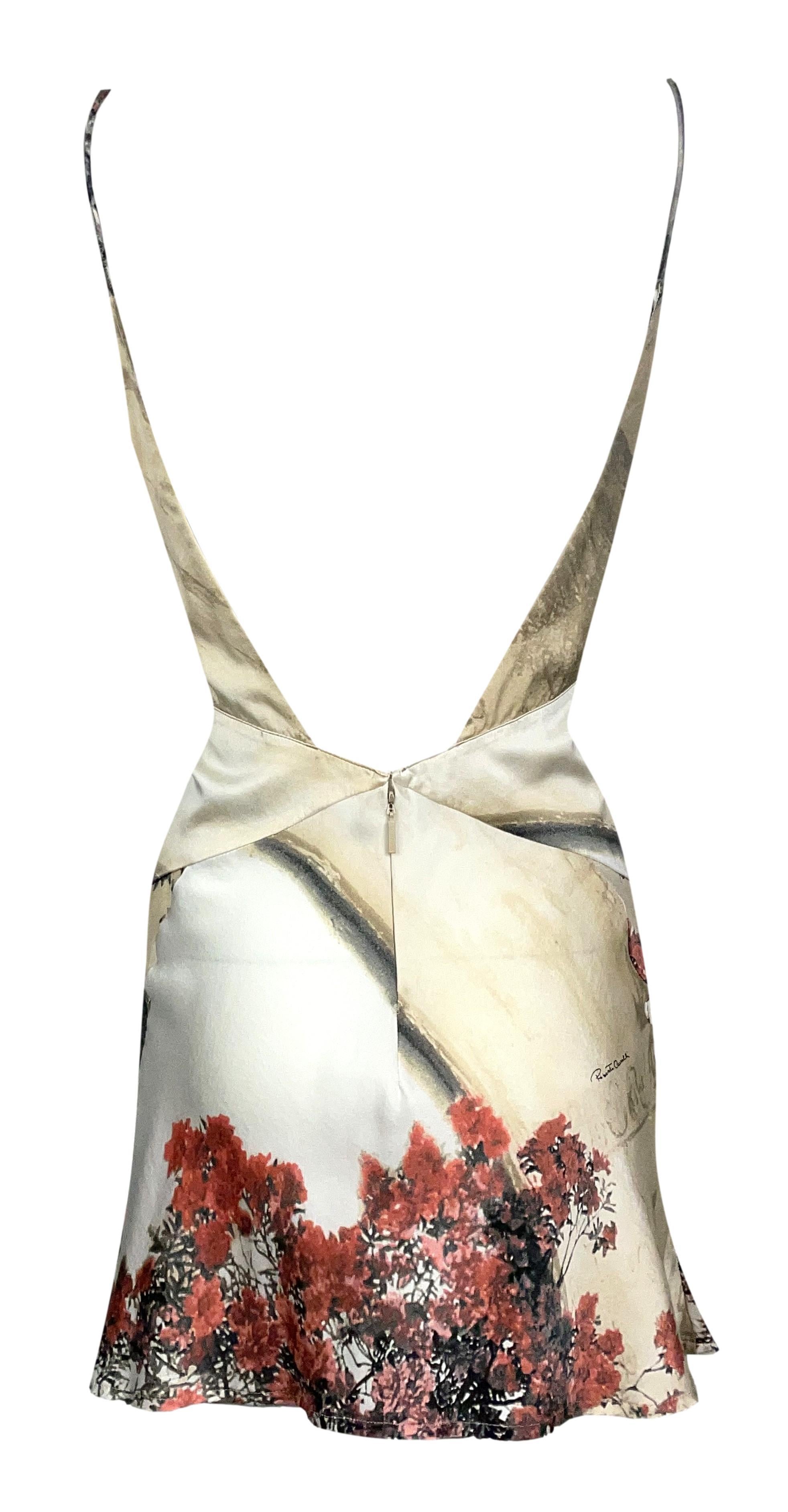 **THANK YOU FOR SHOPPING WITH MES DEUX FILLES**

DESIGNER: S/S 2004 Roberto Cavalli Runway
CONDITION: Good- no holes or stains- has been altered shorter and a piece in the center folded in to expose stomach- can be taken back out to cover stomach if