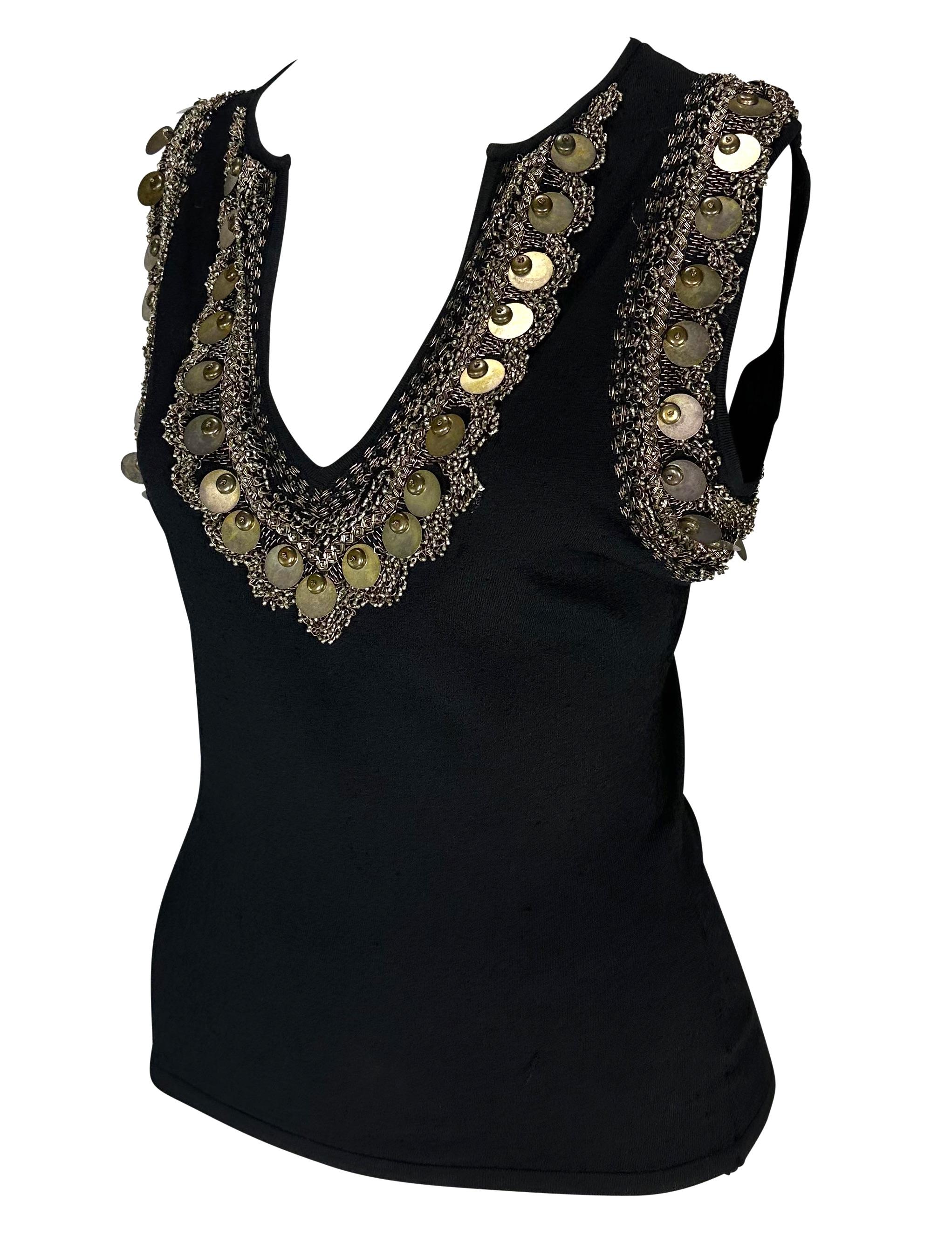 Presenting a fabulous black brass embroidered Versace sleeveless top, designed by Donatella Versace. From the Spring/Summer 2004 collection, this top features a deep v-neckline and is made complete with brassy embroidery, beads, and discs around the