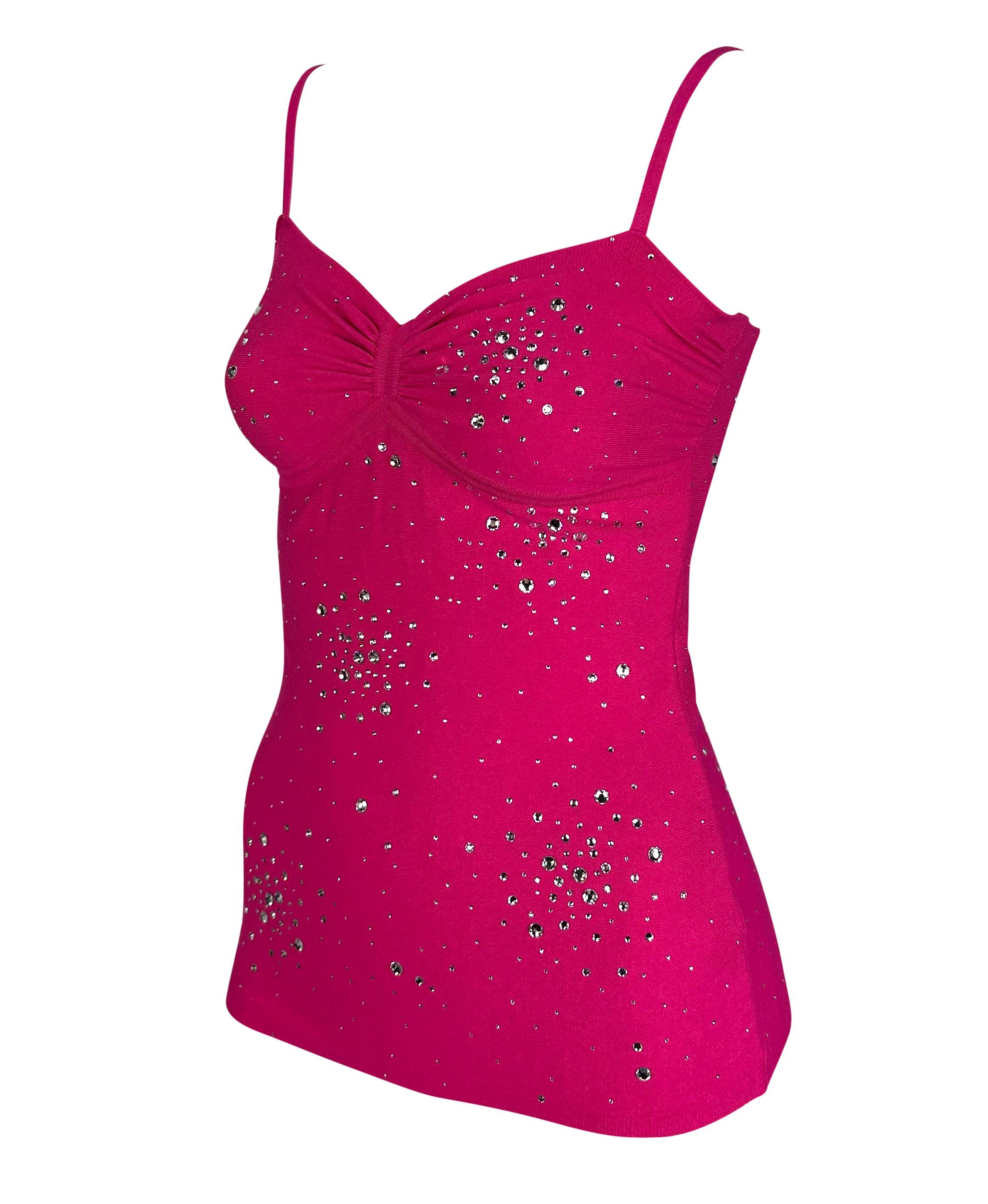 Presenting a fabulous bright pink knit Versace tank top designed by Donatella Versace. From the Spring/Summer 2004 collection, this beautiful top features spaghetti straps and ruching between the breasts, and it is covered with crystal