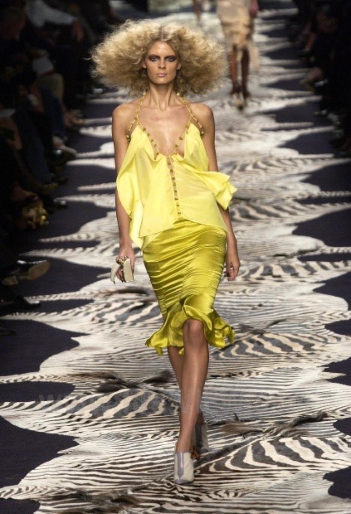 Presenting a fabulous canary yellow Yves Saint Laurent Rive Gauche midi skirt, designed by Tom Ford. From the Spring/Summer 2004 collection, a similar skirt debuted on the season's runway as part of look 19 modeled by Julia Stegner. The panels and