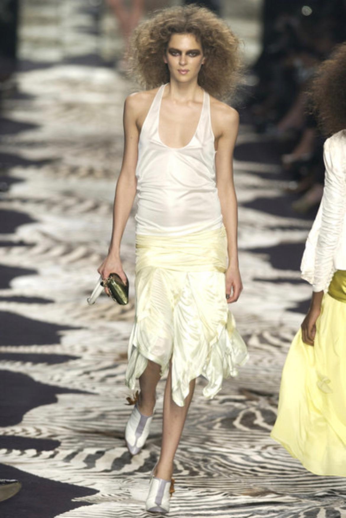Presenting an off-white stretch viscose Yves Saint Laurent Rive Gauche ruffle skirt, designed by Tom Ford. From the Spring/Summer 2004 collection, this skirt debuted on the season's runway on look 24 modeled by Elise Crombez. Featuring a fabulous