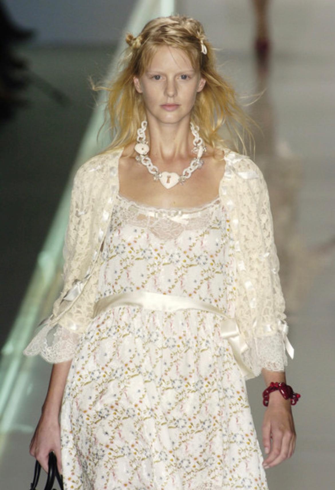TheRealList presents: a floral Diorissimo print Christian Dior Boutique dress, designed by John Galliano. From the Spring/Summer 2005 collection, similar dresses debuted on the runway on looks 7 and 8. This silk slip dress features spaghetti straps