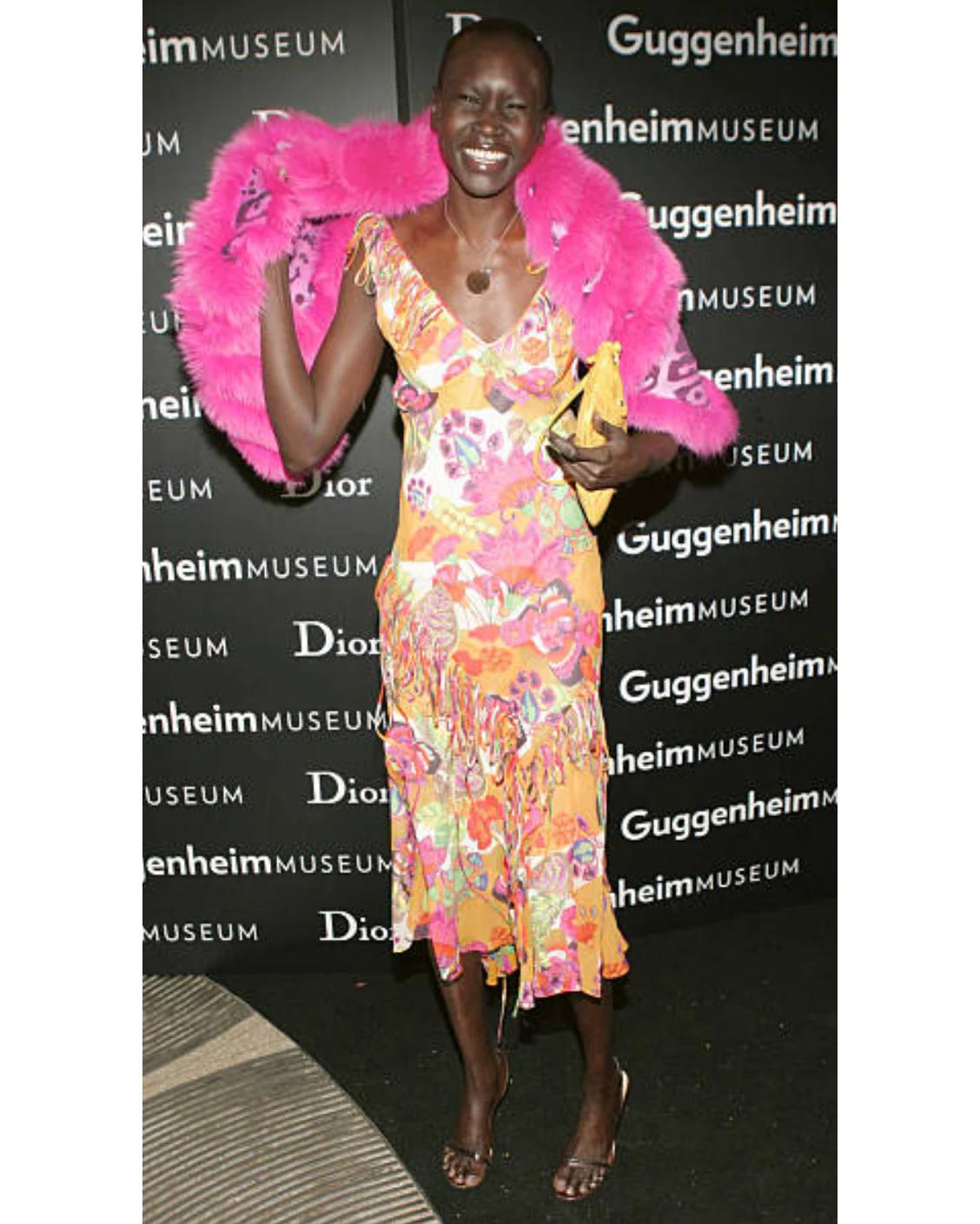 S/S 2005 Christian Dior by John Galliano floral print asymmetrical above-knee silk skirt. Fully patterned silk chiffon bias cut skirt with Galliano's signature fabric button-up side closures. Features oversized pink Dior stamped keyhole button