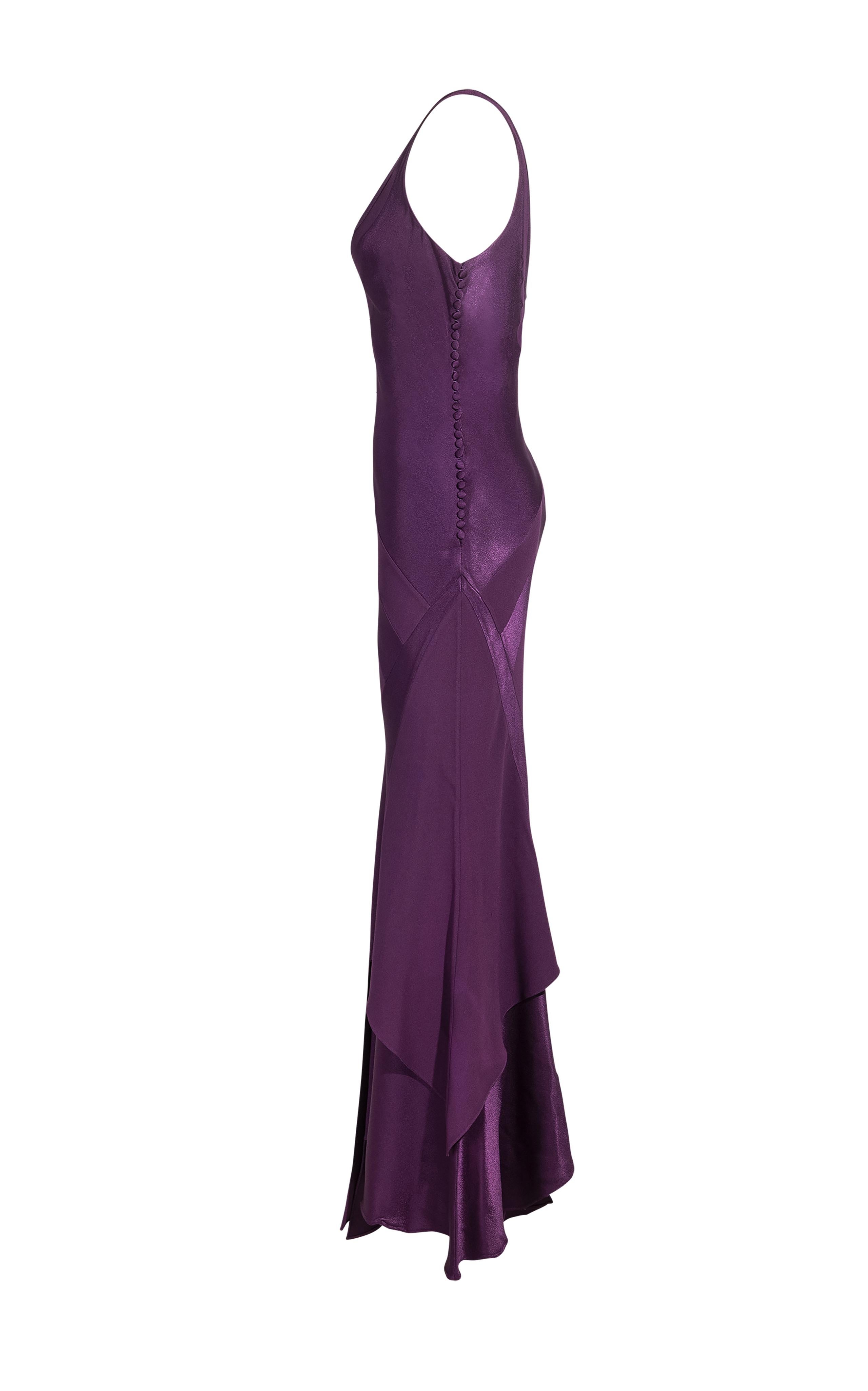 S/S 2005 Christian Dior by John Galliano purple v-neck gown with spiraling geometric details that shape and flatter the body, with deconstructed handkerchief hem. Sleeveless gown with signature 1930's style fabric buttons up the side. 