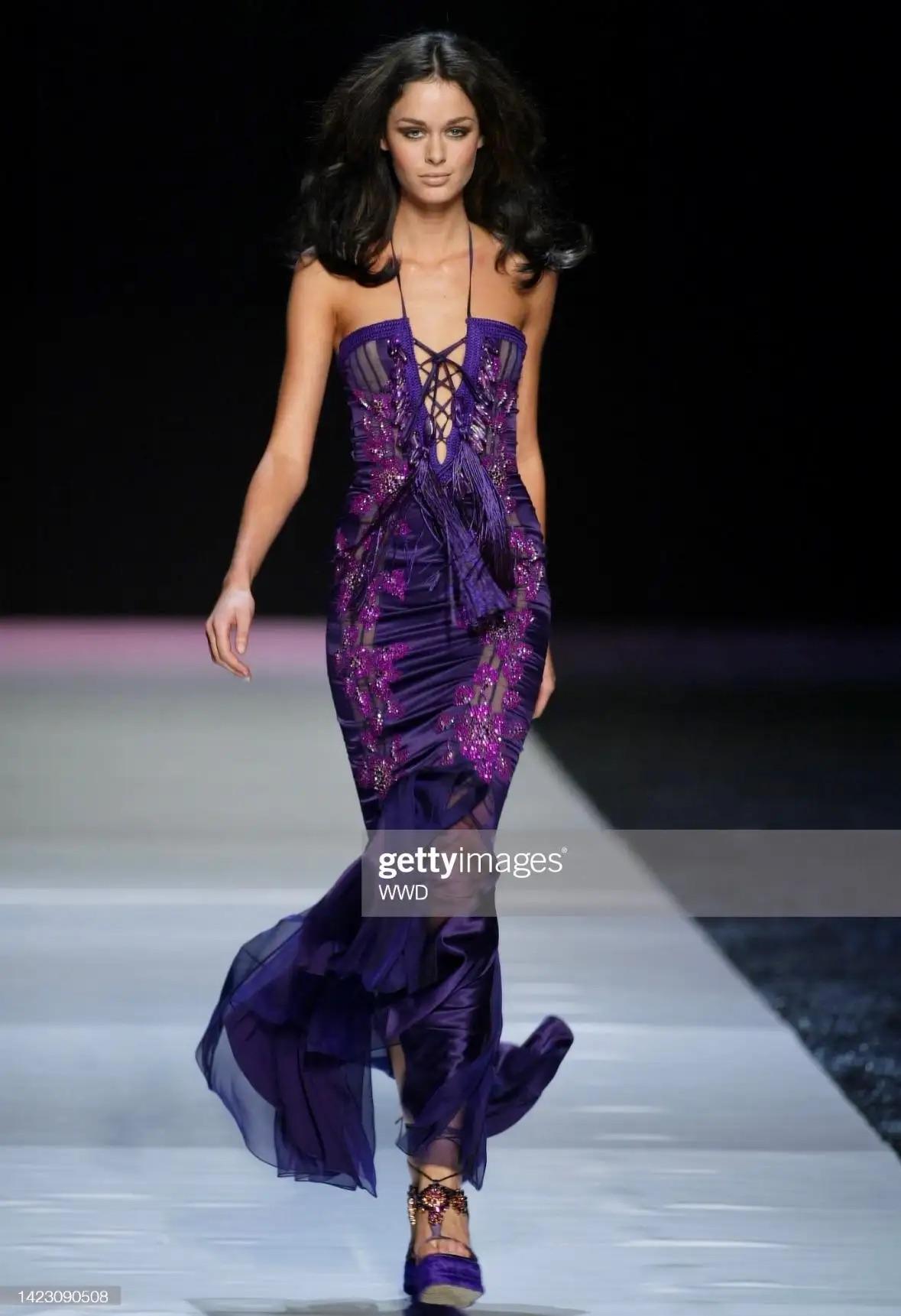 Presenting a stunning purple satin Emanuel Ungaro gown, designed by Giambattista Valli. From the Spring/Summer 2005 collection, a version of this dress debuted on the season’s runway as look 45, modeled by Nicole Trunfio. This fabulous spaghetti