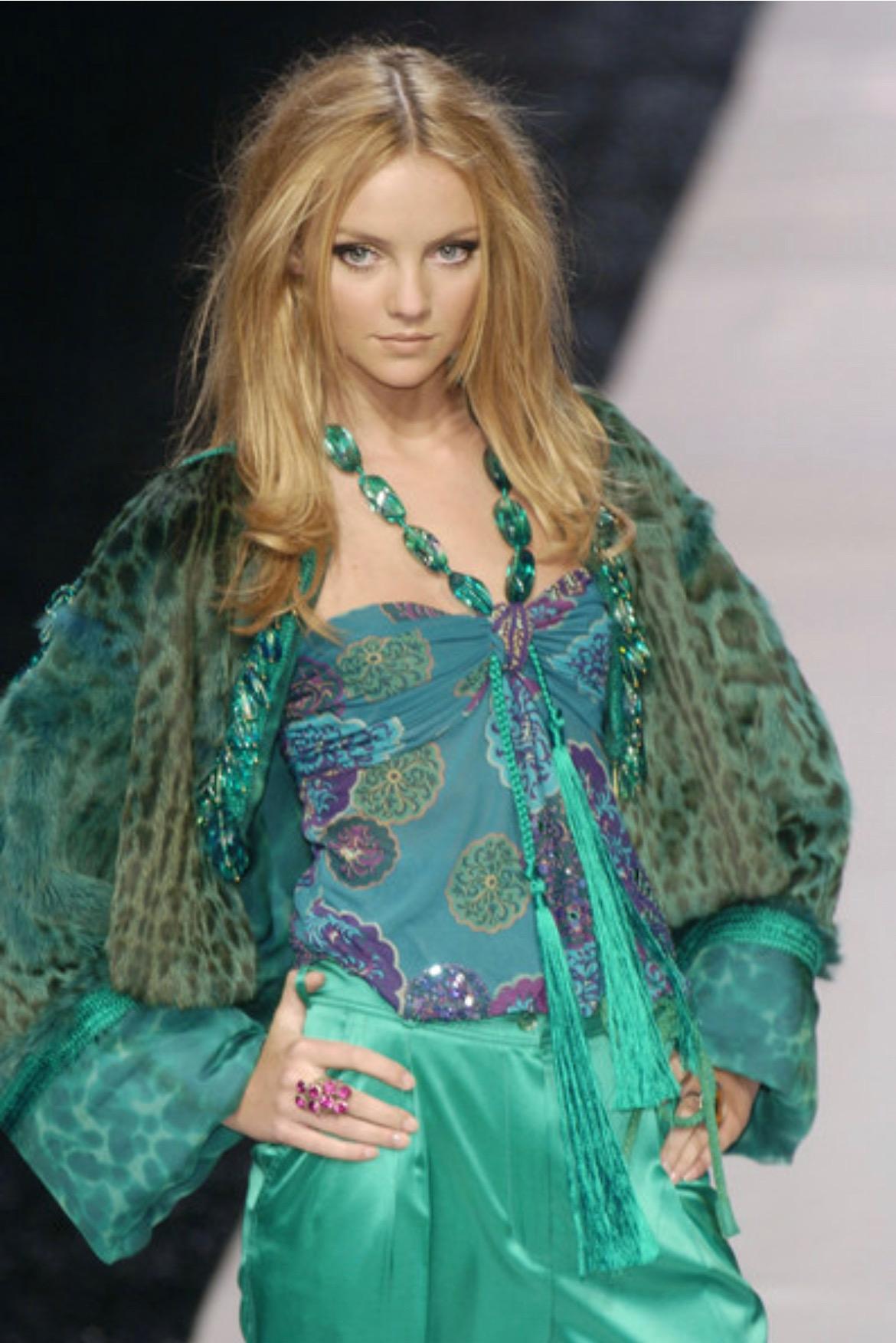 TheRealList presents: a gorgeous teal halter neck Emanuel Ungaro top, designed by Giambattista Valli. From the Spring/Summer 2005 collection, this top a version of this top debuted on the season's runway as part of look 38 modeled by Heather Marks.